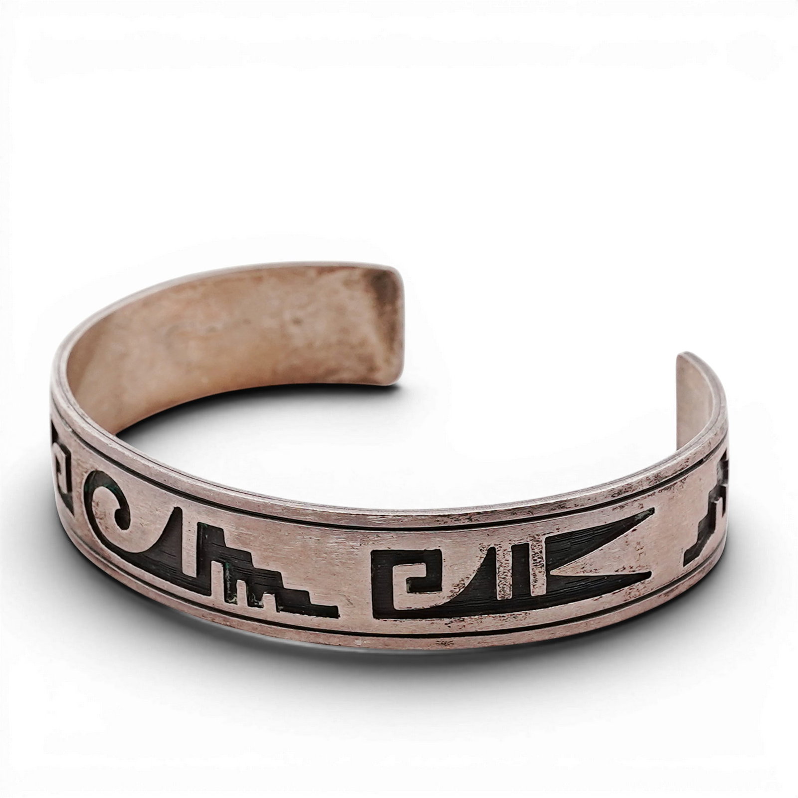 Navajo Sterling Silver Overlay Cuff Bracelet Signed: Navajo Sterling Silver Overlay Cuff Bracelet Signed 1980s-1990s, USA Heavy gauge cuff bracelet executed in overlay technique, featuring a central pueblo and geometric motif cut through a top silver la