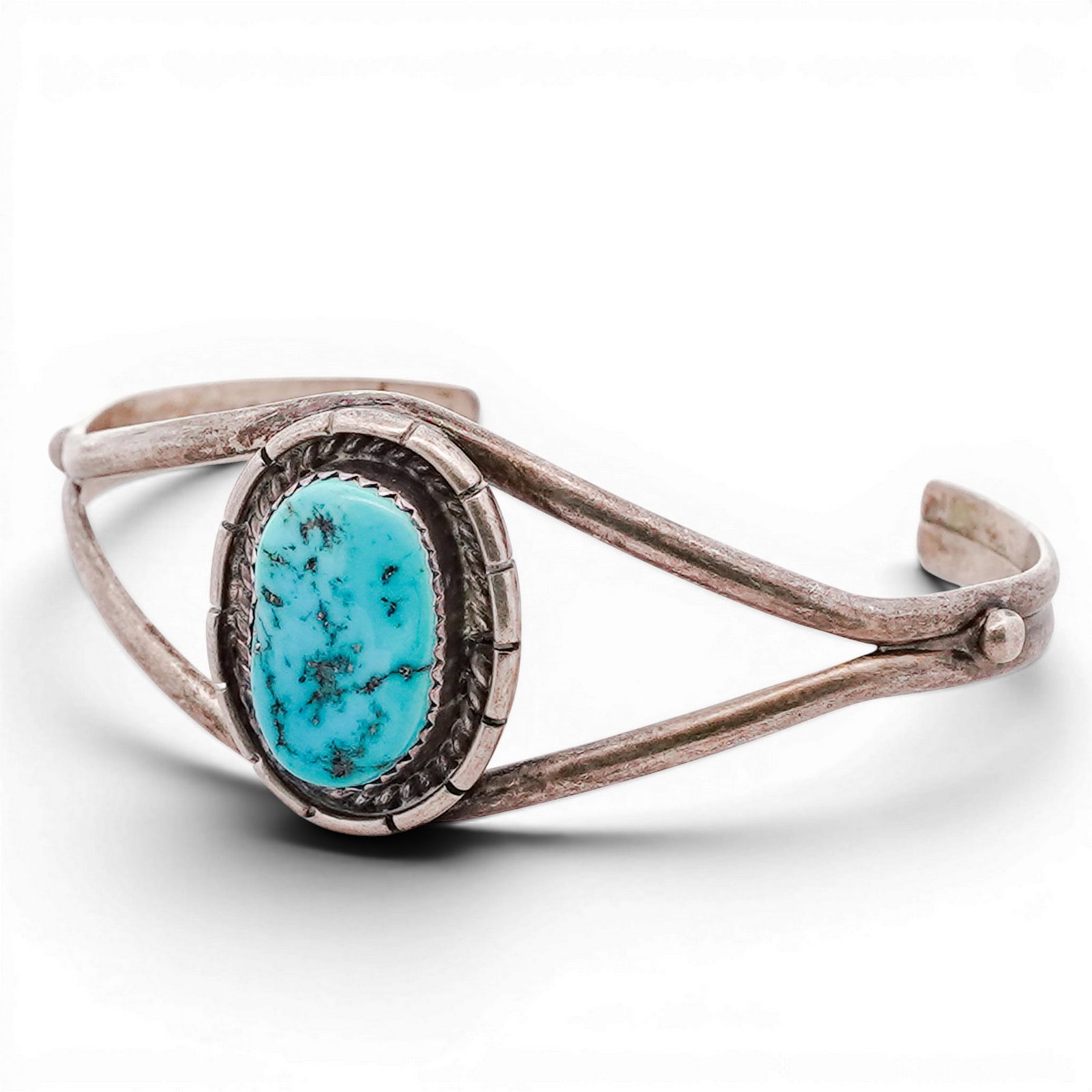 Vintage Navajo Sterling Silver & Turquoise Cuff Bracelet Signed: Vintage Navajo Sterling Silver & Turquoise Cuff Bracelet Signed Sterling silver cuff set with an oval turquoise cabochon in a serrated bezel, framed by twisted rope wire and applied bead accents. Moun