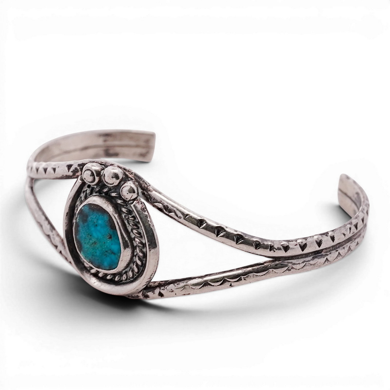 Vintage Navajo Sterling Silver & Turquoise Cuff Signed: Vintage Navajo Sterling Silver & Turquoise Cuff Signed 1960s-1970s, USA Sterling silver cuff set with an oval turquoise cabochon in a serrated bezel, framed by twisted rope wire and applied bead accen