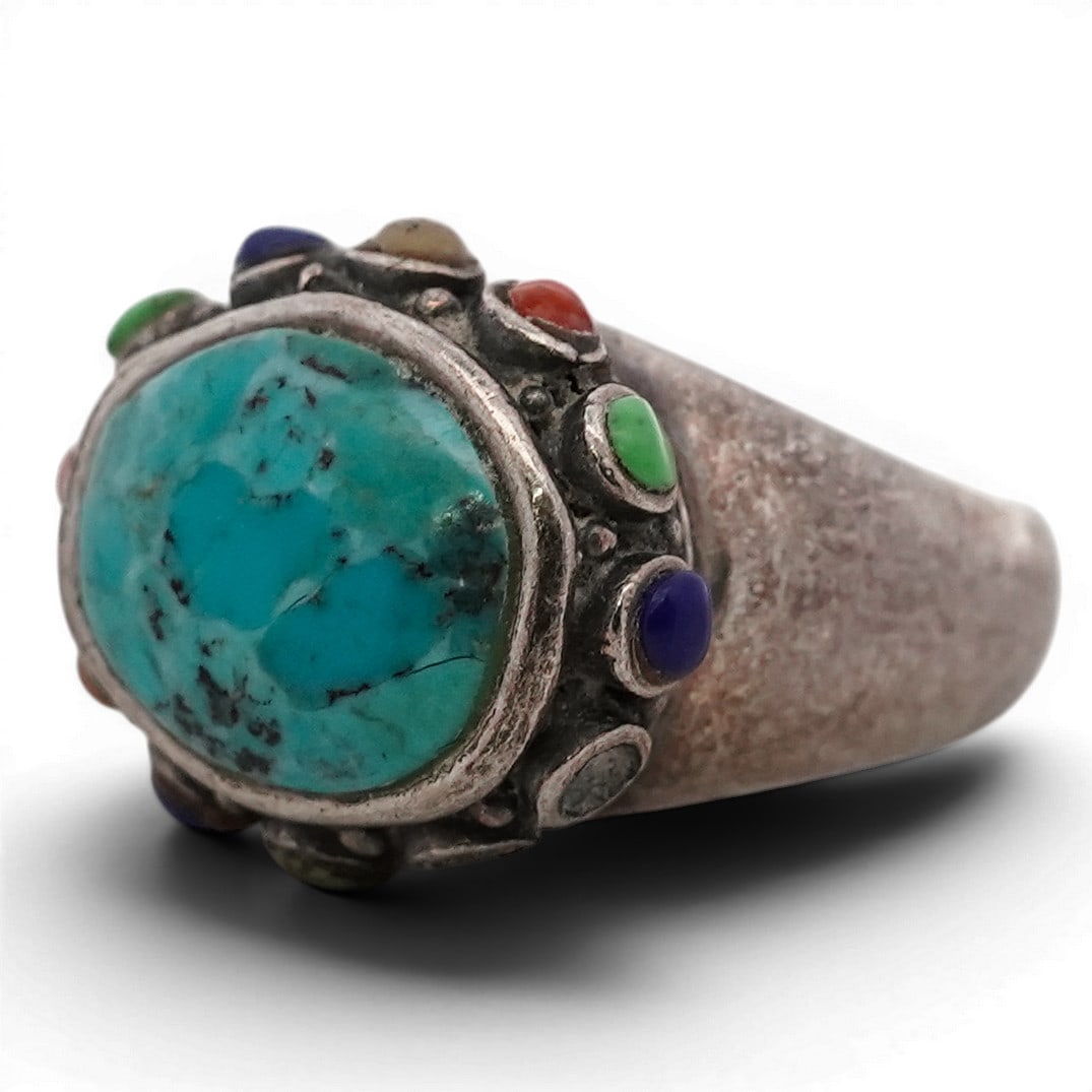 Barse Sterling Silver Turquoise & Multi-Stone Ring: Barse Sterling Silver Turquoise & Multi-Stone Ring 1990s-2000s, USA Sterling silver ring by Barse, set with a central oval turquoise cabochon exhibiting natural matrix. The stone is mounted in a smoot