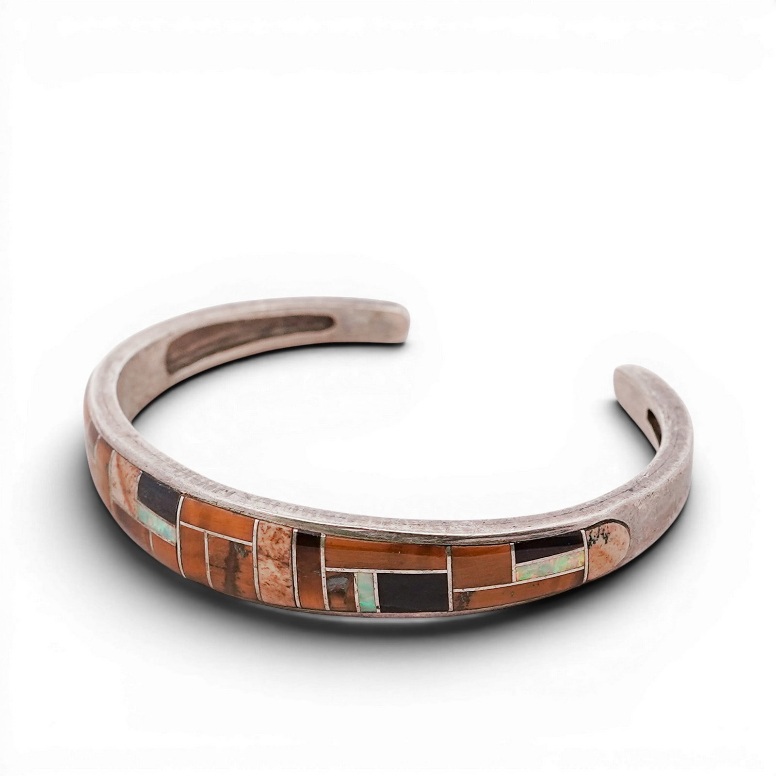 Vintage Zuni Sterling Silver & Multi-Stone Inlay Cuff Bracelet Signed: Vintage Zuni Sterling Silver & Multi-Stone Inlay Cuff Bracelet Signed Late 20th Century, USA Vintage Zuni sterling silver cuff with a continuous channel inlay of mixed stones including brown jasper, t