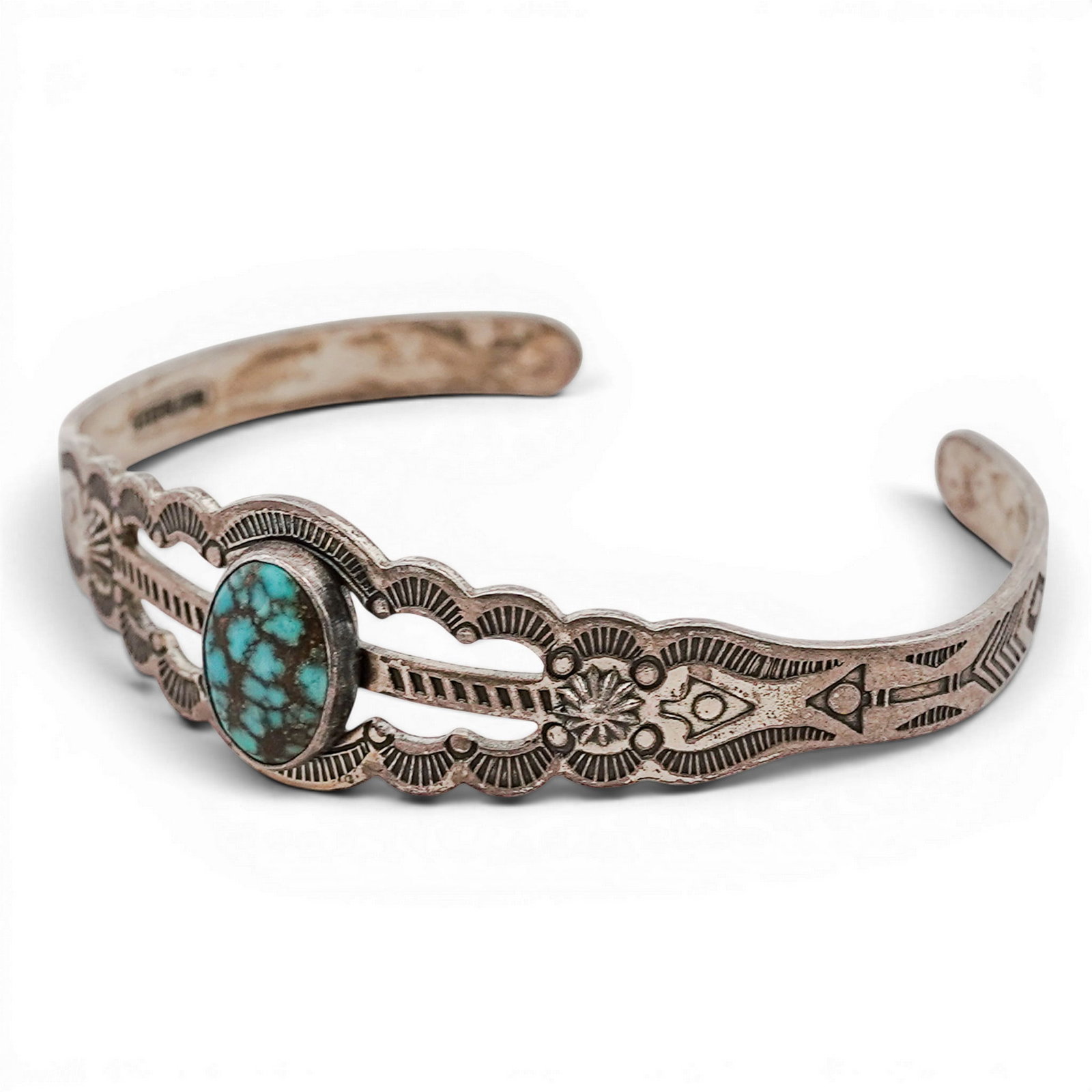Vintage Navajo Sterling Silver & Turquoise Small Cuff Bracelet: Vintage Navajo Sterling Silver & Turquoise Small Cuff Bracelet 1970s-1980s, USA Hand-stamped cuff bracelet centered with an oval turquoise cabochon in a plain bezel, set within a scalloped and pierced