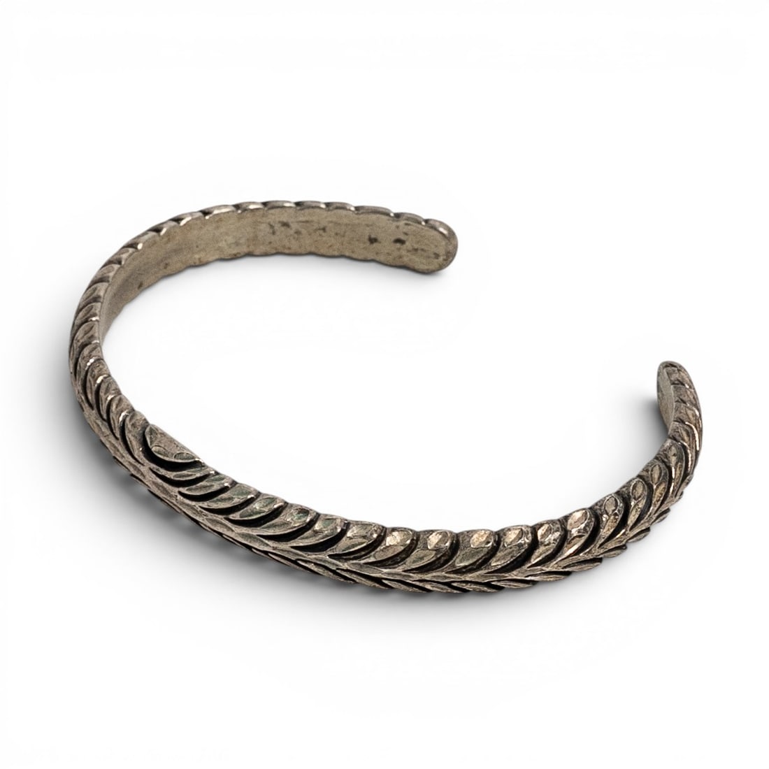 Vintage Navajo Sterling Silver Stamped Cuff Bracelet Signed: Vintage Navajo Sterling Silver Stamped Cuff Bracelet Signed 1970s-1980s, USA Hand fabricated sterling silver cuff bracelet with continuous stamped leaf and feather motif covering the full face of the 