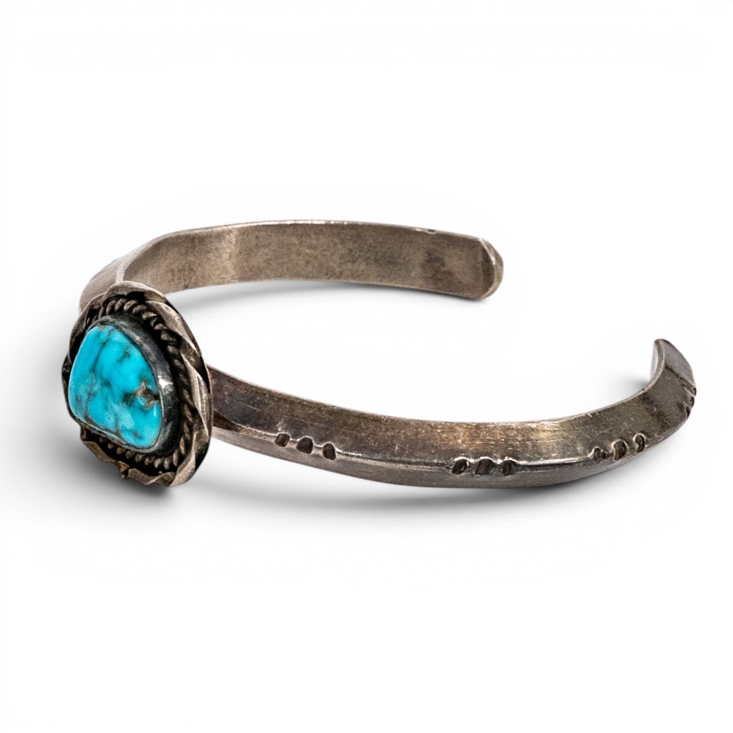 Vintage Navajo Sterling Silver & Turquoise Wirework Cuff Bracelet: Vintage Navajo Sterling Silver & Turquoise Wirework Cuff Bracelet 1970s-1980s, USA Vintage Navajo tested sterling silver cuff bracelet featuring a freeform turquoise stone with bright blue color and d