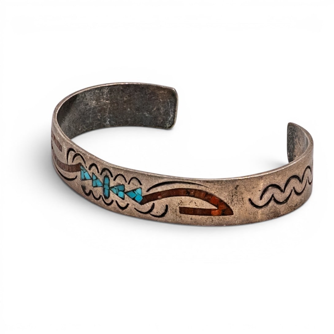 Vintage Navajo Sterling Silver Turquoise & Coral Chip Inlay Cuff Bracelet Signed: Vintage Navajo Sterling Silver Turquoise & Coral Chip Inlay Cuff Bracelet Signed 1970s-1980s, USA Narrow sterling silver cuff bracelet with chip inlay work set into engraved channel grooves. Center fa