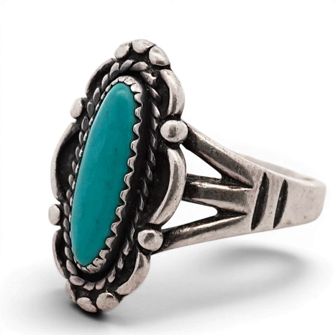 Vintage Navajo Sterling Silver & Turquoise Ring Signed: Vintage Navajo Sterling Silver & Turquoise Ring Signed 1970s-1980s, USA Sterling silver ring set with an elongated marquise turquoise cabochon, framed by twisted rope wire and applied bead accents wit