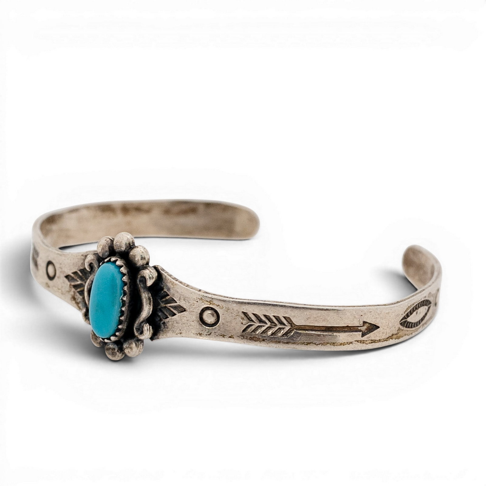 Vintage Navajo Sterling Silver & Turquoise Cuff Bracelet Signed: Vintage Navajo Sterling Silver & Turquoise Cuff Bracelet Signed 1970s-1980s, USA Tiny vintage Navajo sterling silver cuff bracelet featuring a central oval turquoise cabochon set in a serrated bezel. 