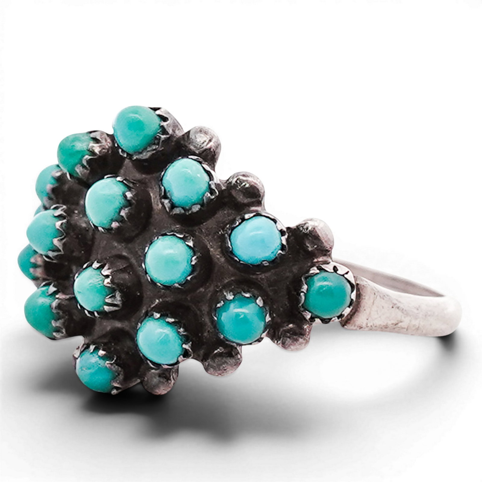 Vintage Navajo Sterling Silver & Turquoise Cluster Ring: Vintage Navajo Sterling Silver & Turquoise Cluster Ring 1970s-1980s, USA Sterling silver ring set with multiple small round turquoise cabochons arranged in a clustered dome formation, each within indi