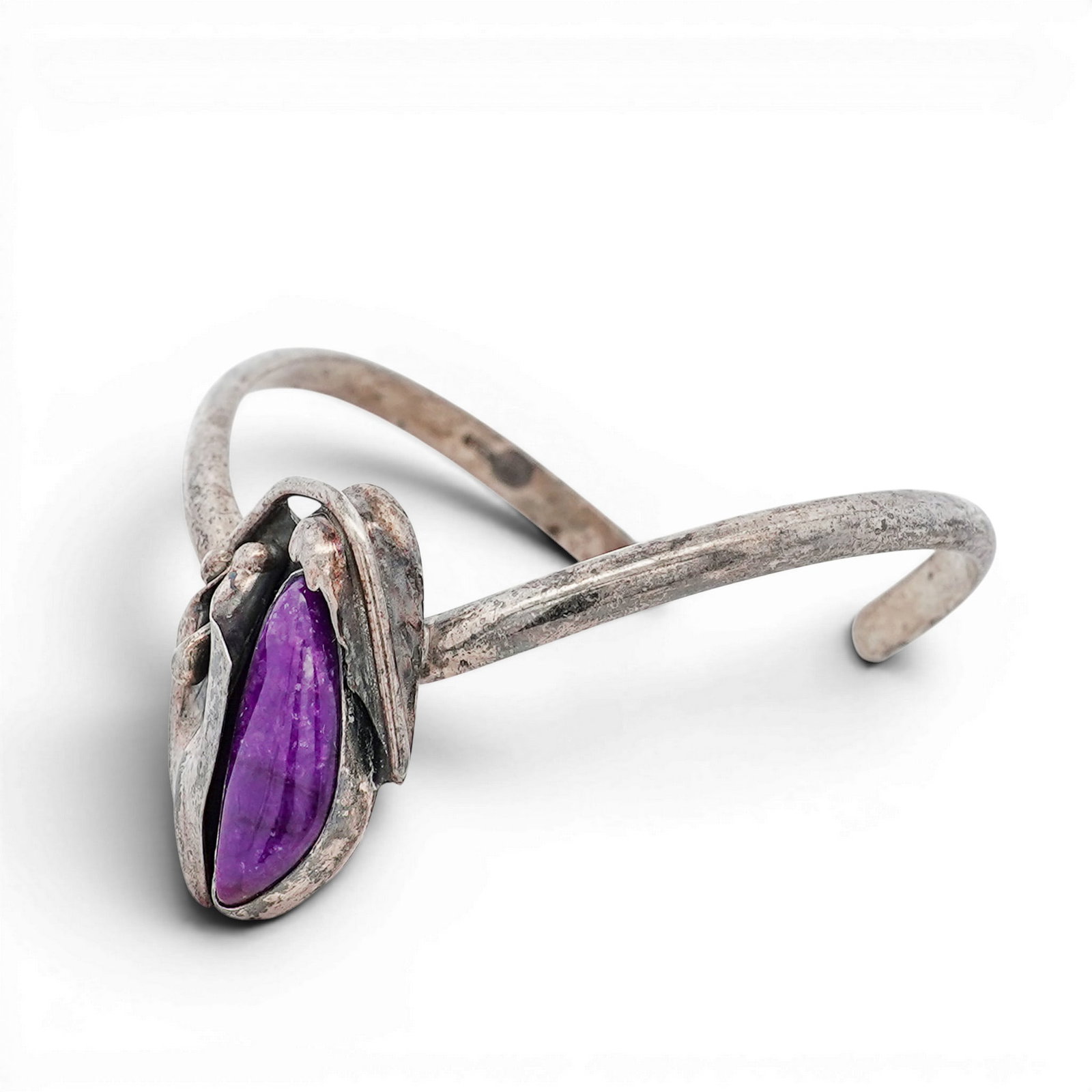 Vintage Navajo Sterling Silver & Sugilite Cuff Bracelet: Vintage Navajo Sterling Silver & Sugilite Cuff Bracelet 1970s-1980s, USA Vintage Navajo sterling silver cuff bracelet set with an elongated oval sugilite cabochon measuring approximately 22 × 8 mm, d