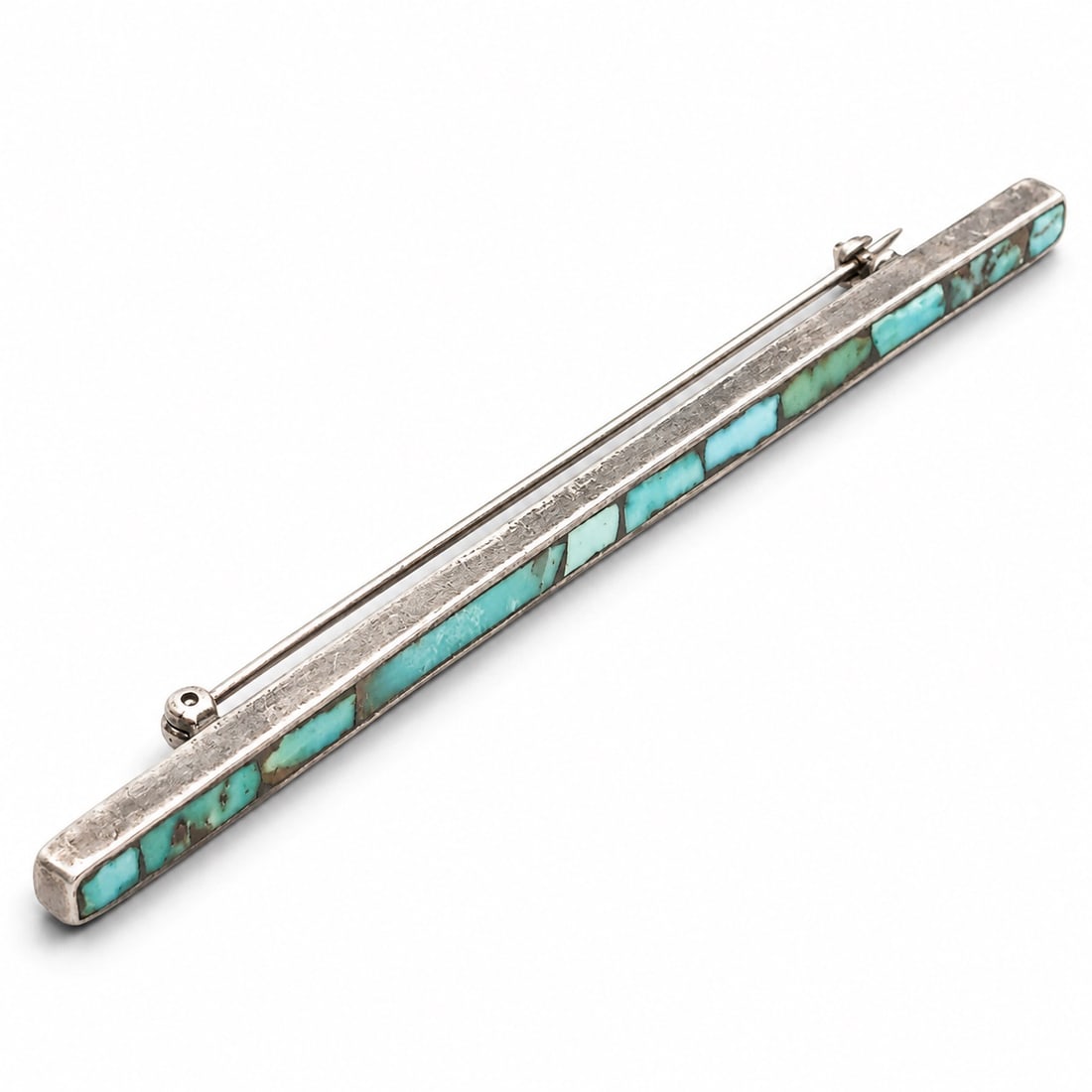 Vintage Southwest Sterling Silver & Turquoise Channel Inlay Bar Brooch: Vintage Southwest Sterling Silver & Turquoise Channel Inlay Bar Brooch Late 20th Century, USA Vintage Sterling silver bar brooch of elongated rectangular form set with continuous turquoise chip channe