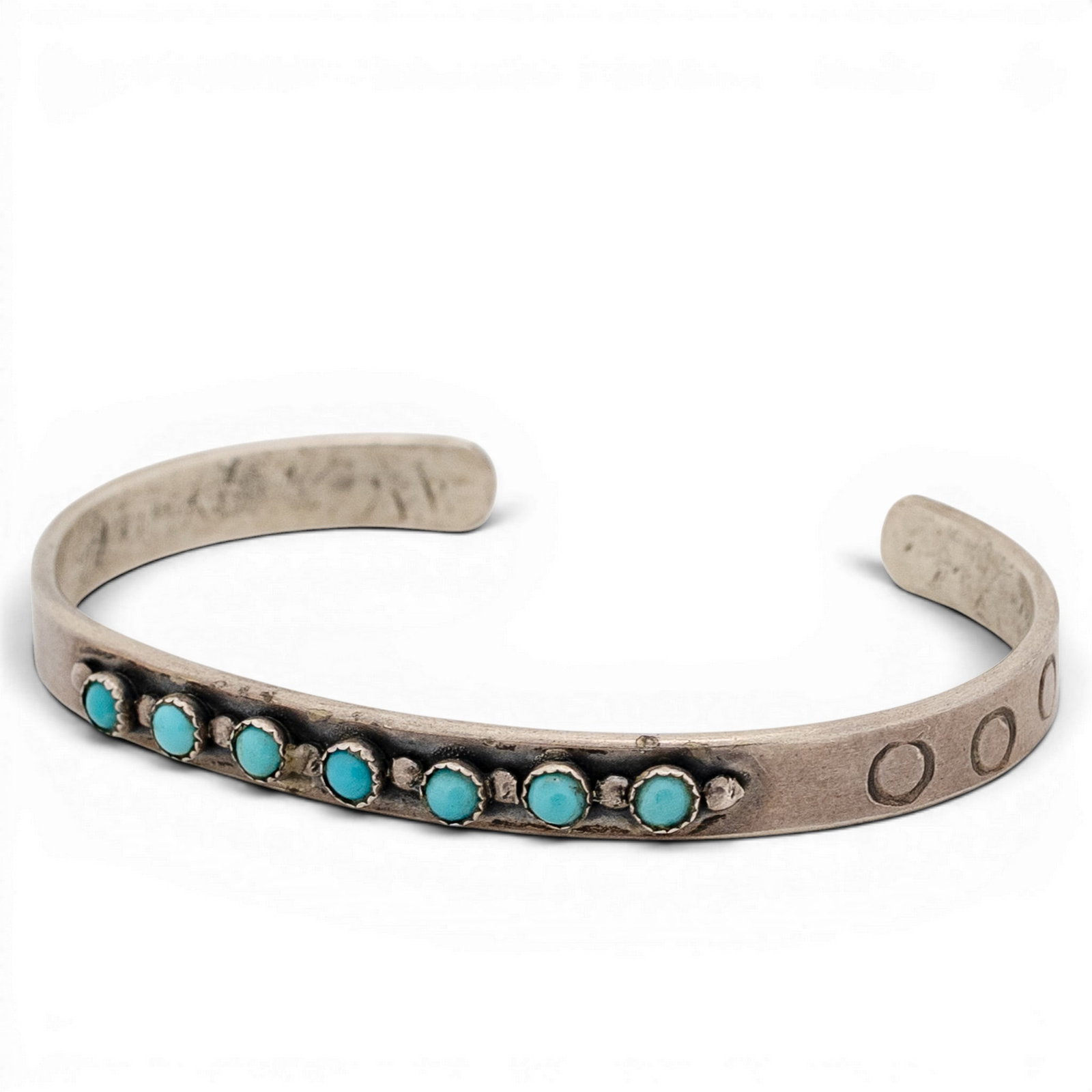 Vintage Sterling Silver & Turquoise Row Cuff Bracelet: Vintage Sterling Silver & Turquoise Row Cuff Bracelet 1970s-1980s Vintage sterling silver cuff bracelet set with a linear row of small round turquoise cabochons in serrated bezels, separated by applie