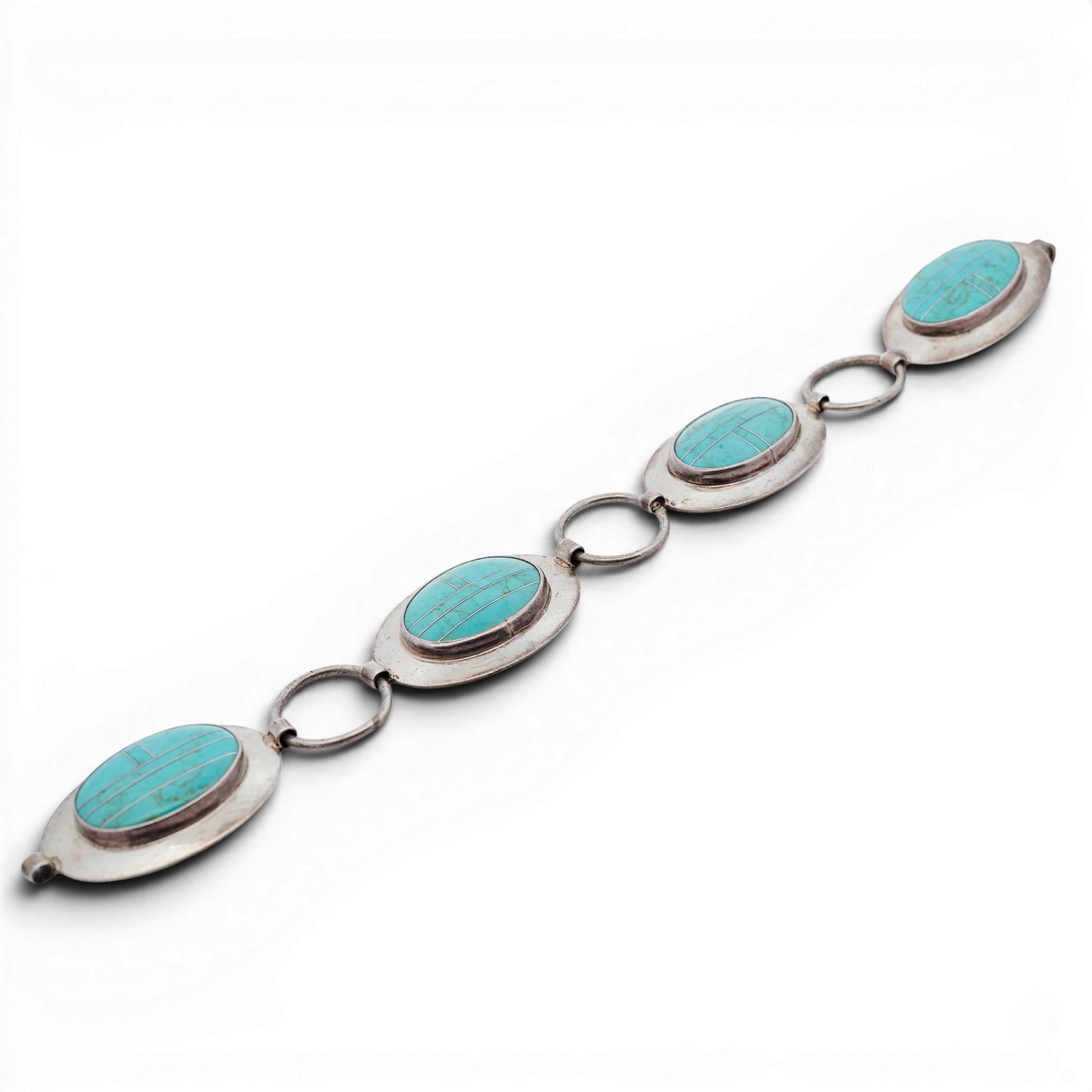 Vintage Navajo Sterling Silver & Turquoise Inlay Link Bracelet: Vintage Navajo Sterling Silver & Turquoise Inlay Link Bracelet 1970s–1980s, USA Vintage Navajo Sterling Silver link bracelet composed of oval turquoise inlay panels set within wide silver frames. Ea