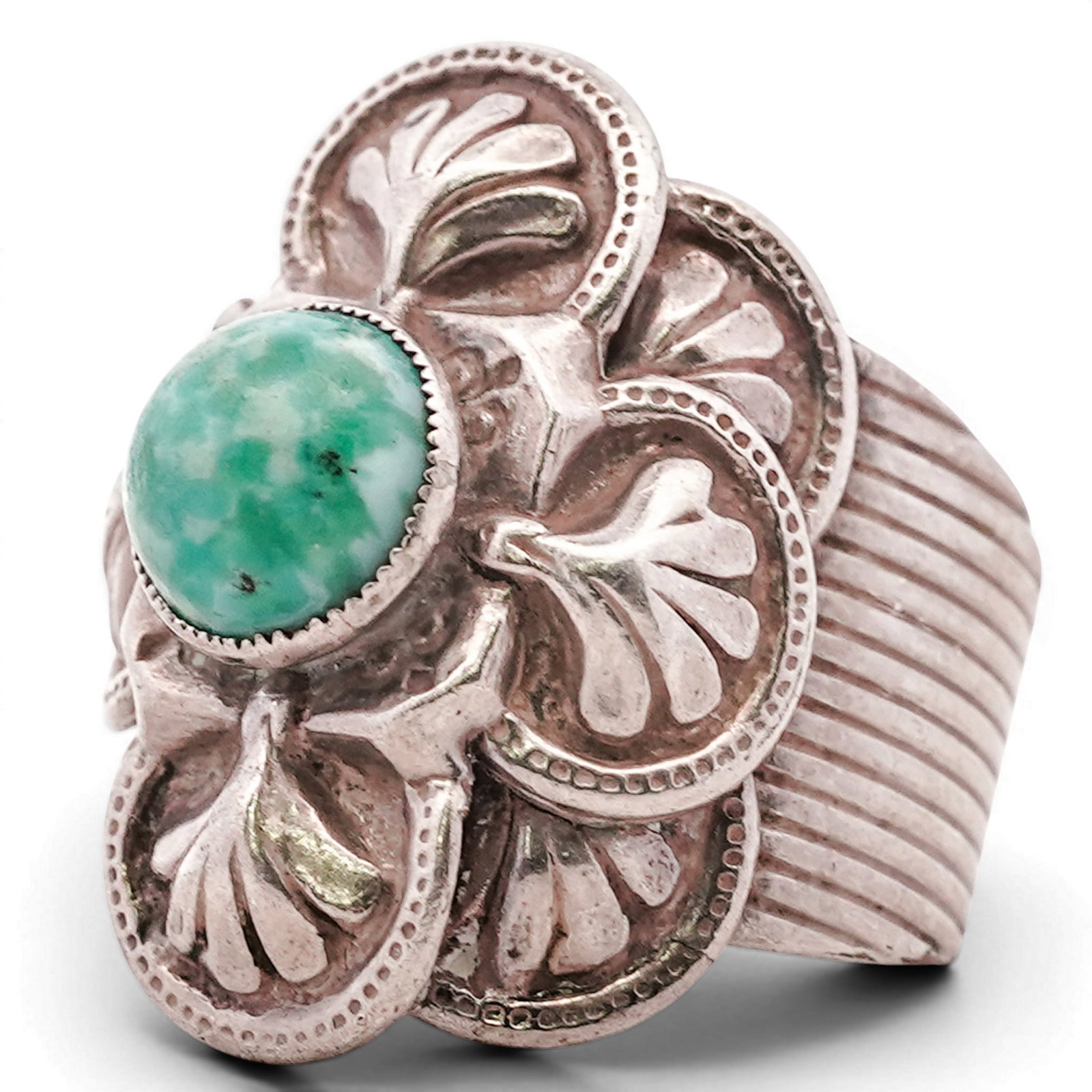 Vintage Navajo Sterling Silver & Green Turquoise Ring Signed: Vintage Navajo Sterling Silver & Green Turquoise Ring Signed 1970s–1980s, USA Sterling silver ring set with a round green turquoise cabochon in a serrated bezel, mounted within a cluster of applied 