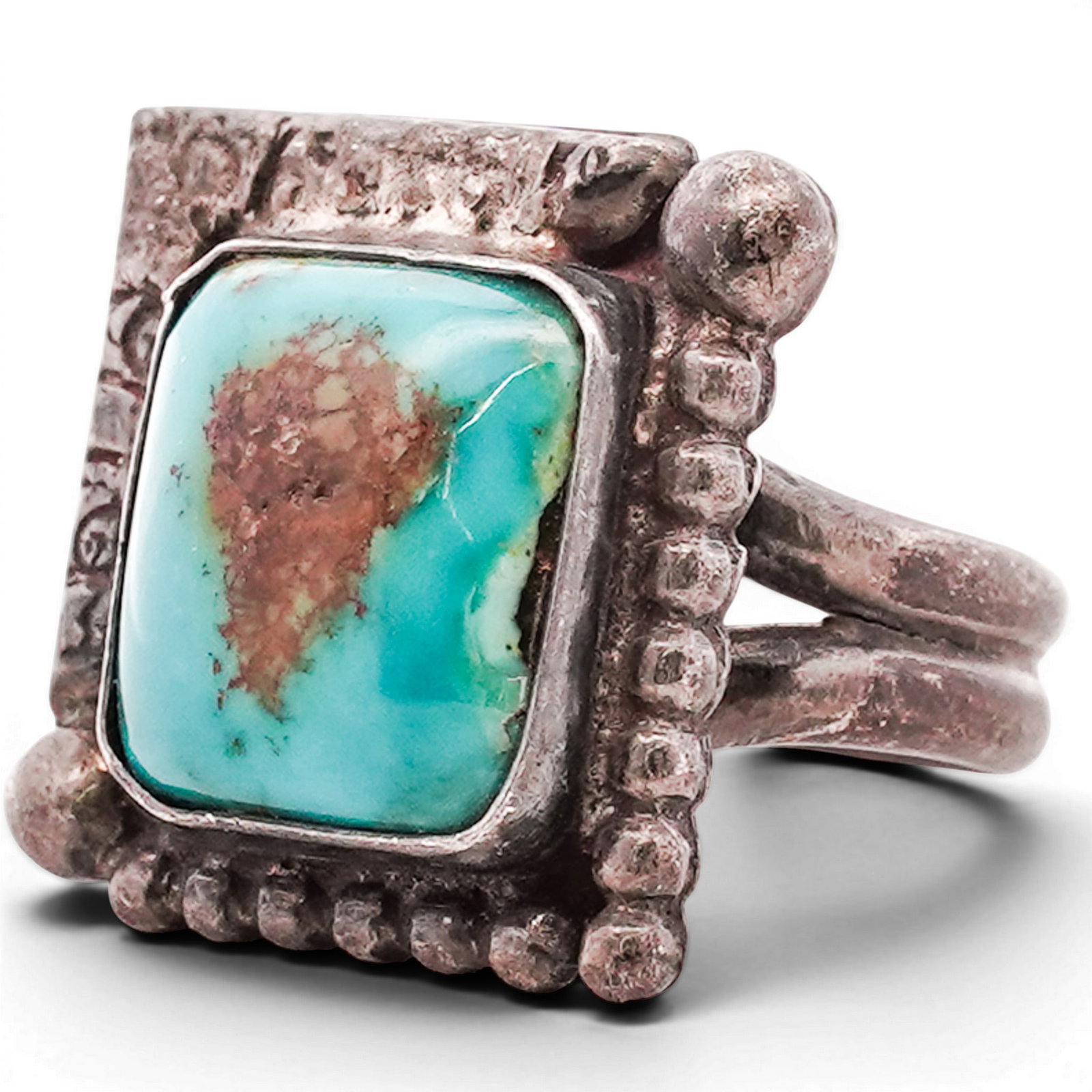Vintage Southwestern Sterling Silver & Turquoise Ring: Vintage Southwestern Sterling Silver & Turquoise Ring 1970s–1980s, USA Sterling silver ring set with a rectangular turquoise cabochon exhibiting a prominent central matrix within a smooth bezel. The