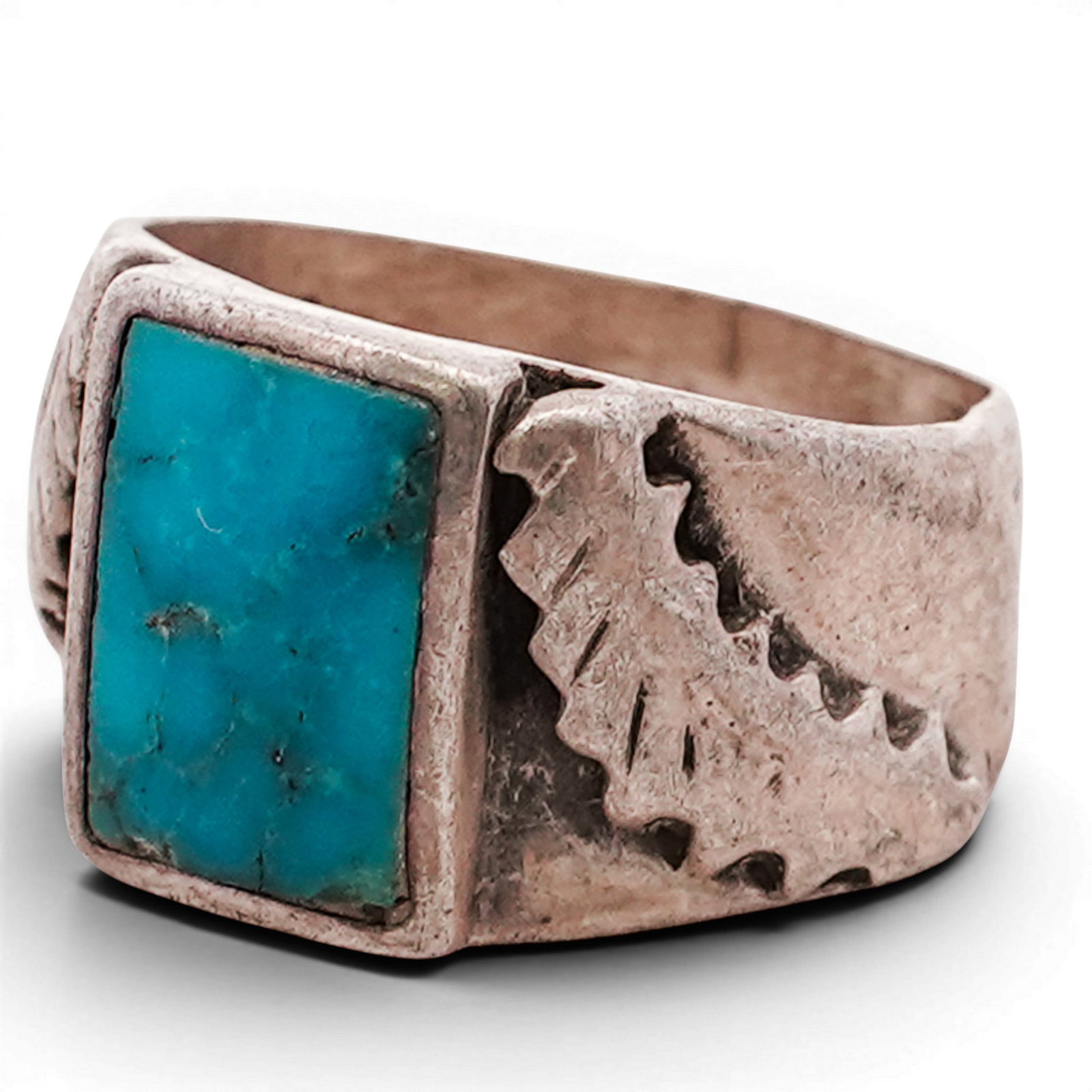 Vintage Navajo Sterling Silver & Turquoise Ring: Vintage Navajo Sterling Silver & Turquoise Ring Late 20th Century, USA Vintage Navajo sterling silver ring set with a rectangular turquoise cabochon of medium blue coloration with slight natural