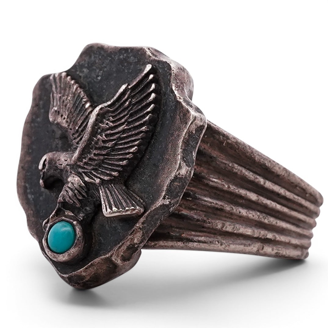 Vintage Francis M. Begay Navajo Sterling Silver & Turquoise Eagle Ring: Vintage Francis M. Begay Navajo Sterling Silver & Turquoise Eagle Ring Late 20th Century, USA Vintage Navajo sterling silver ring by Francis M. Begay, featuring a raised eagle in flight applied to a s