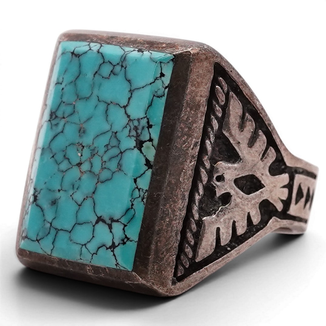 Vintage Navajo Sterling Silver & Turquoise Ring Signed: Vintage Navajo Sterling Silver & Turquoise Ring Signed Late 20th Century, USA Vintage sterling silver ring set with a square turquoise cabochon displaying blue coloration with pronounced black spiderw