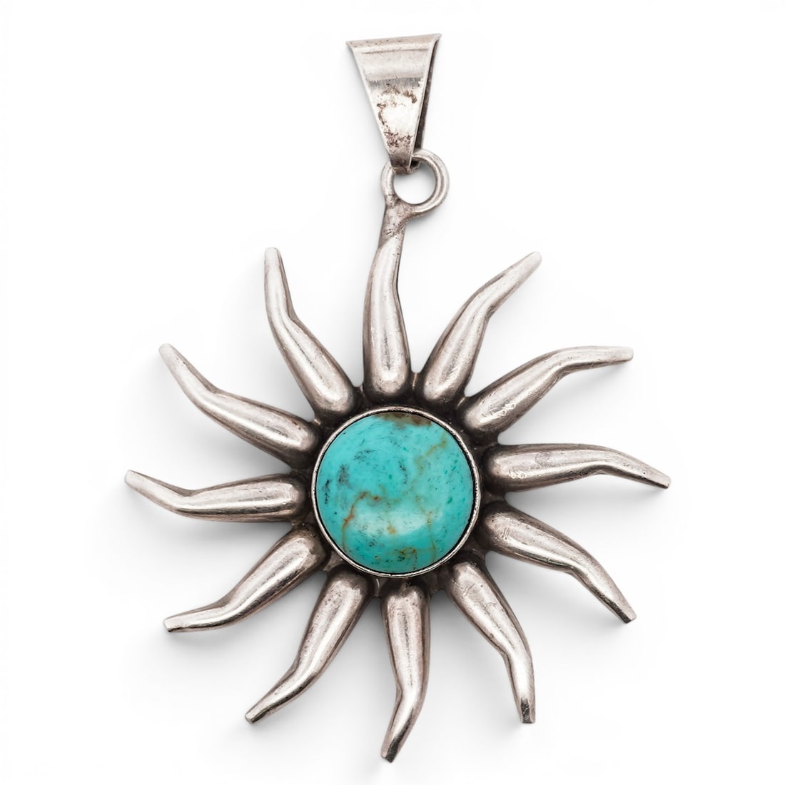 Vintage Mexican Sterling Silver & Turquoise Sun Pendant Signed: Vintage Mexican Sterling Silver & Turquoise Sun Pendant Signed 1970s-1980s, Mexican Sunburst-form pendant with radiating curved rays centered by a round turquoise cabochon in a bezel setting. Smooth