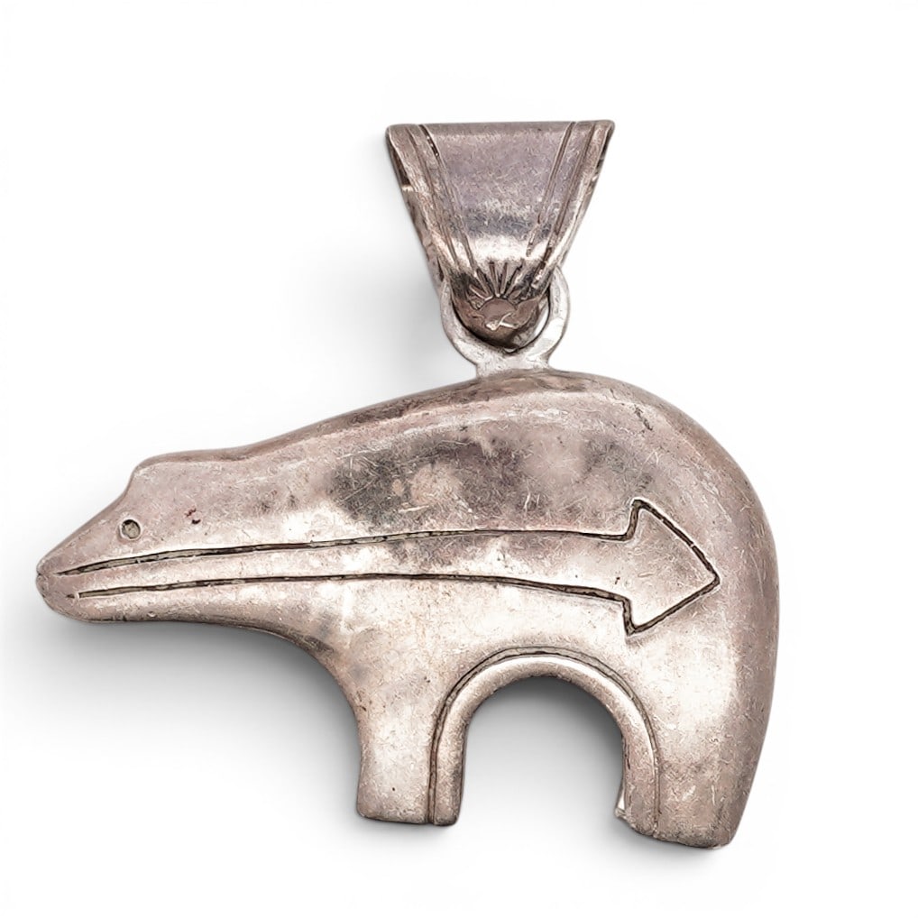 Southwest Sterling Silver Bear Pendant Signed: Southwest Sterling Silver Bear Pendant Signed Late 20th Century, USA Sterling silver pendant in stylized bear form with incised arrow motif. Cast construction with applied bail. Signed GS. Stamped