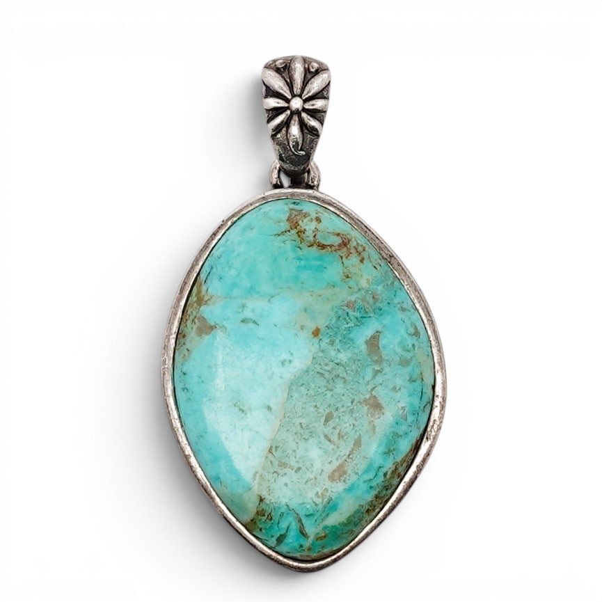 Thai Sterling Silver & Turquoise Pendant Signed: Thai Sterling Silver & Turquoise Pendant Signed Late 20th Century Thai pendant set with a large oval turquoise cabochon within a smooth bezel, the reverse with openwork floral lattice backing, the bai