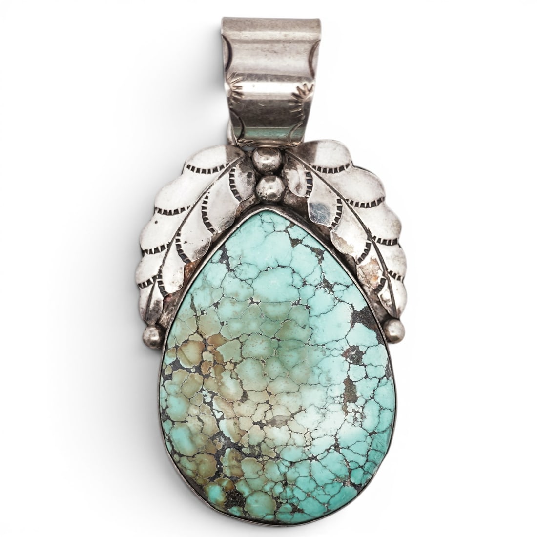 Vintage Navajo Sterling Silver & Turquoise Pendant Signed: Vintage Navajo Sterling Silver & Turquoise Pendant Signed Late 20th Century, USA Vintage Navajo sterling silver pendant set with a large teardrop turquoise cabochon with pronounced brown matrix, frame