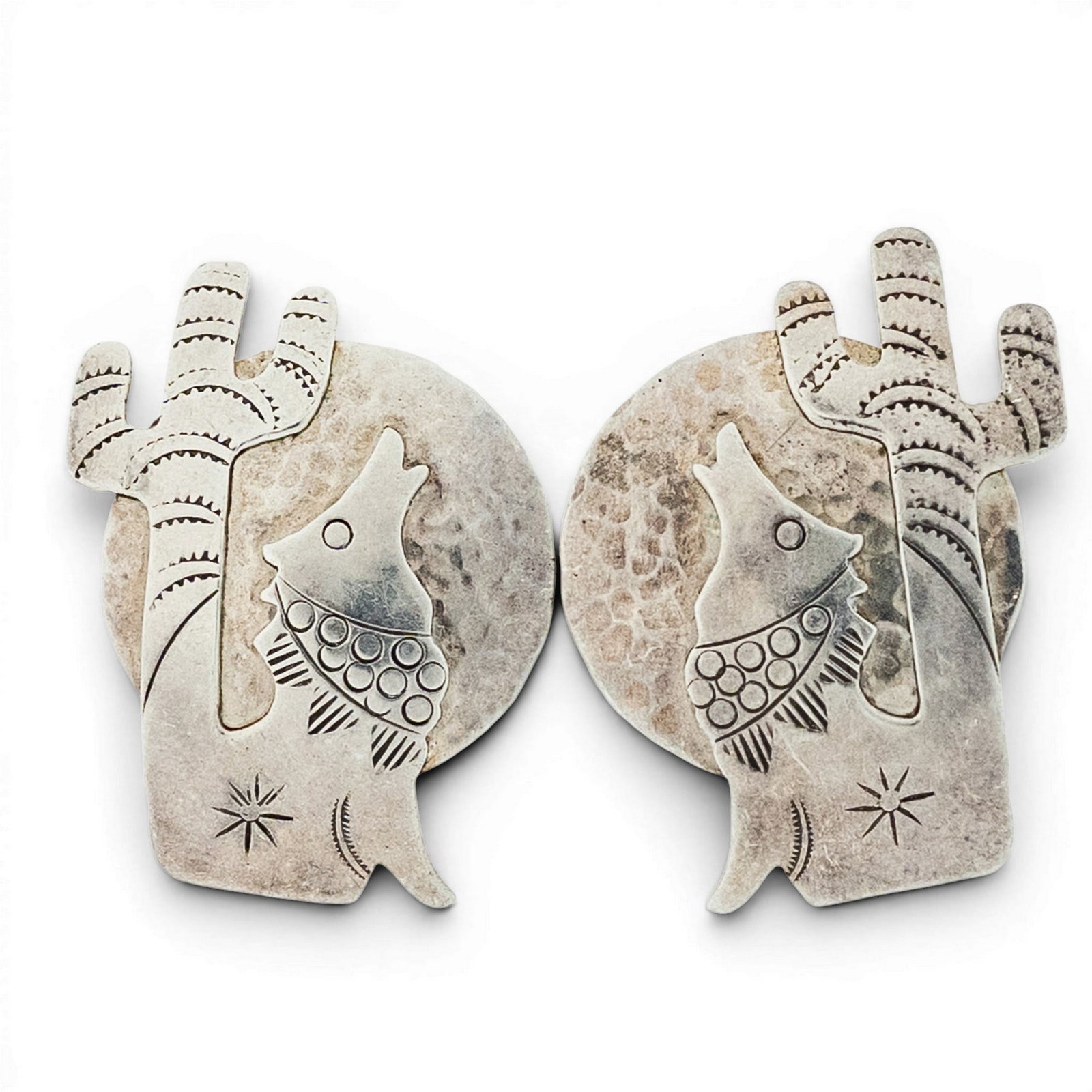 Vintage Navajo Sterling Silver Overlay Earrings: Vintage Navajo Sterling Silver Overlay Earrings 1970s–1980s, USA Pair of Southwestern sterling silver earrings with layered howling wolf and cactus appliqué over hammered circular backplates accent