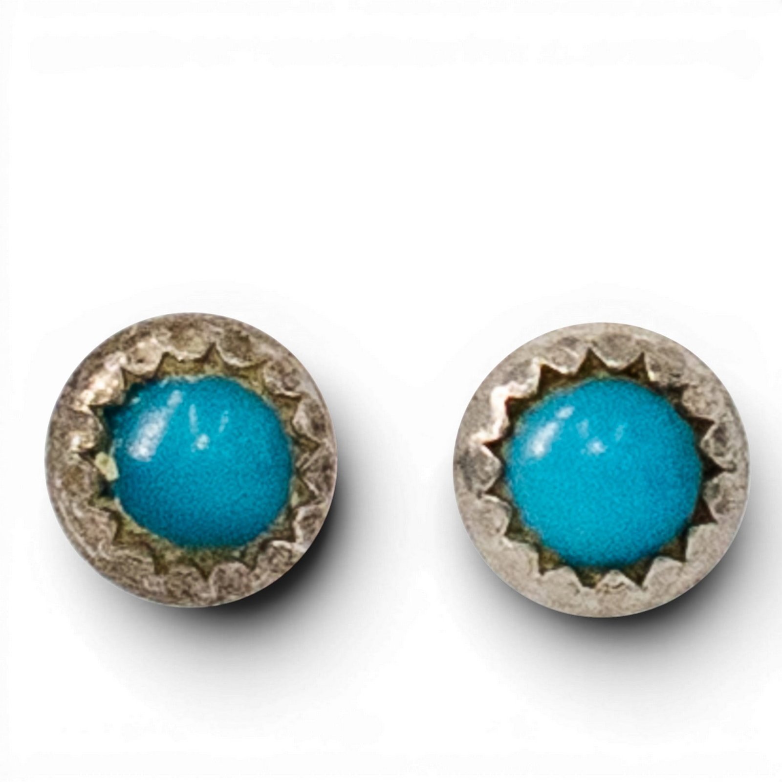 Vintage Navajo Sterling Silver & Turquoise Stud Earrings: Vintage Navajo Sterling Silver & Turquoise Stud Earrings 1970s–1980s, USA Pair of Southwestern sterling silver stud earrings each set with round turquoise cabochons in serrated bezel settings. Weigh