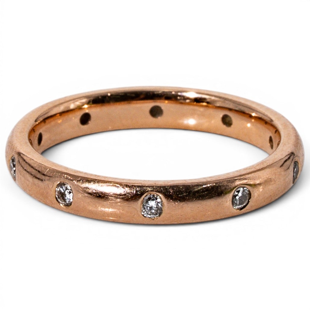 14k Gold & Diamond Band Ring: 14k Gold & Diamond Band Ring 1990s-2000s, USA 14k yellow gold band ring set with ten flush-mounted round brilliant diamonds measuring approximately 2mm each, totaling approximately 0.30 carats. Polish