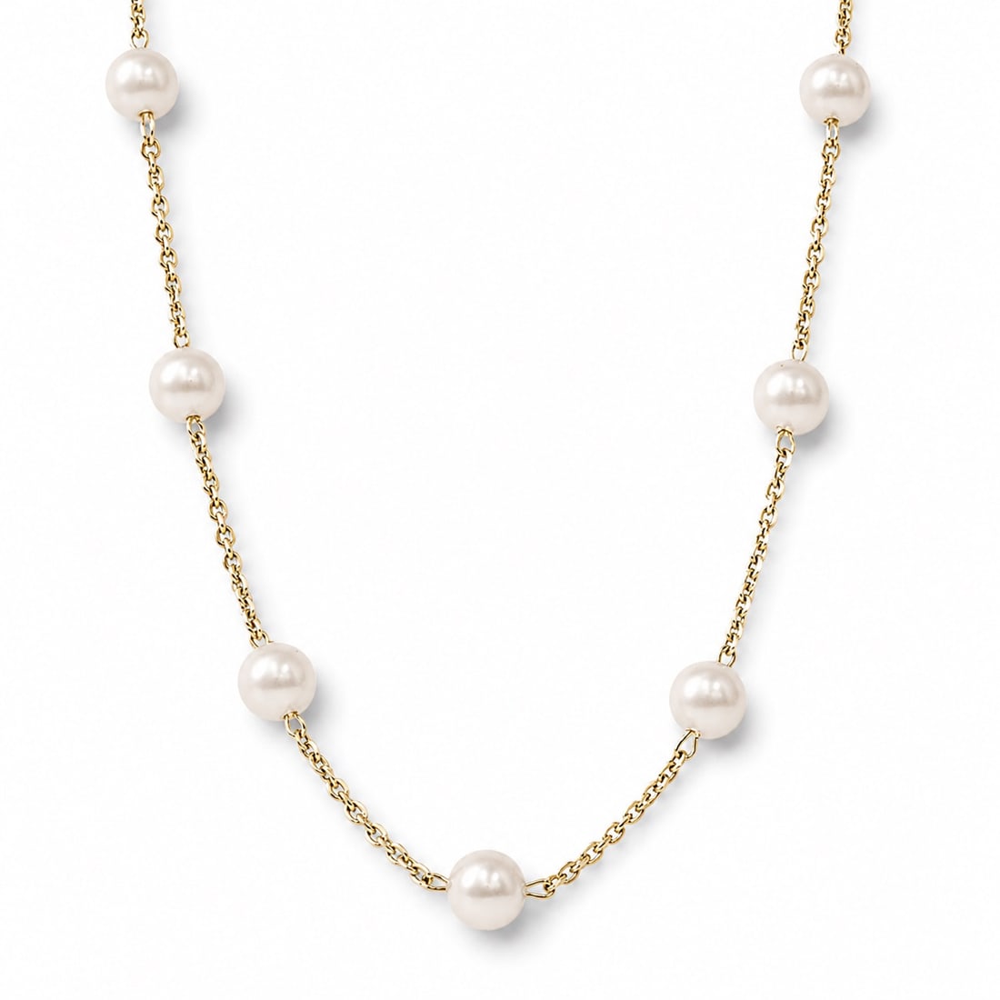 14k Gold & Cultured Pearl Station Necklace: 14k Gold & Cultured Pearl Station Necklace 1990s 14k yellow gold station necklace featuring evenly spaced cultured pearls measuring approximately 7mm, connected by fine gold chain links with spring ri