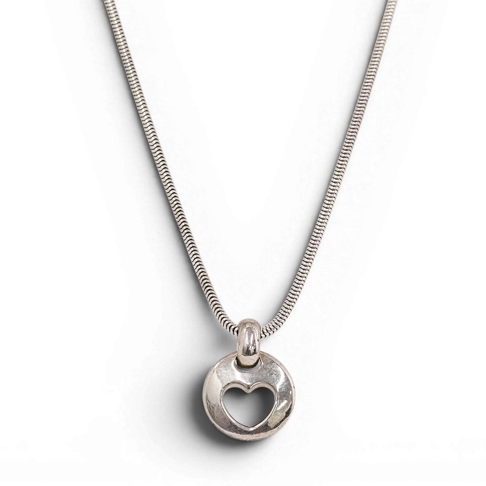 Elsa Peretti for Tiffany & Co. Sterling Silver Open Heart Pendant Necklace: Elsa Peretti for Tiffany & Co. Sterling Silver Open Heart Pendant Necklace 1999, Italian Sterling silver Elsa Peretti Open Heart pendant necklace, the iconic asymmetrical heart motif suspended from a 