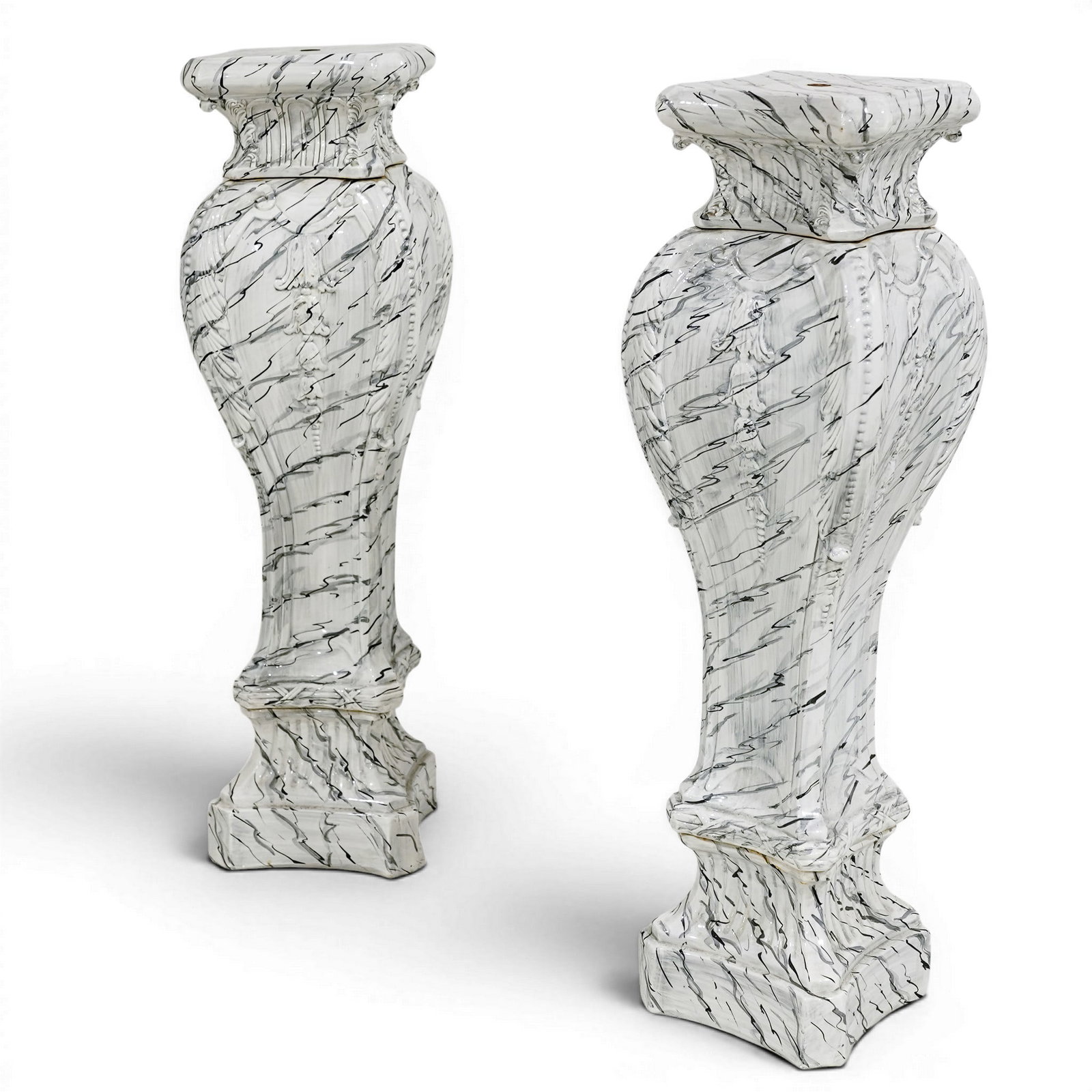 Pair of Swedish Ceramic Trompe L’oeil Pedestals: Pair of Swedish Ceramic Trompe L’oeil Pedestals Mid-20th Century, Sweden Pair of Swedish ceramic pedestals executed in a trompe l’oeil marbleized design, featuring an elegant