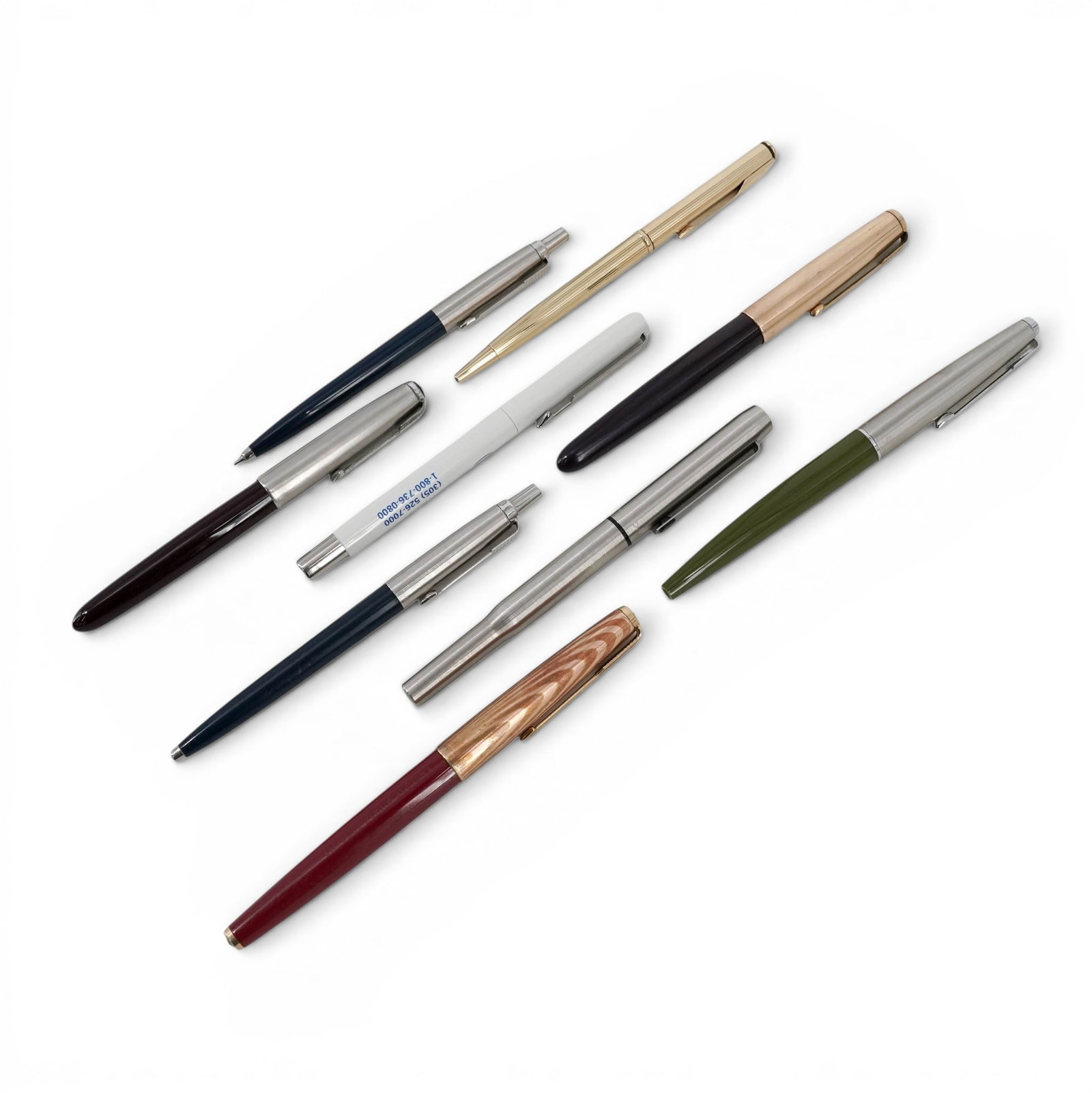 (9 Pcs) Parker & Assorted Writing Instrument Lot: (9 Pcs) Parker & Assorted Writing Instrument Lot 1960s-1990s, USA & UK Lot comprising nine writing instruments including multiple Parker ballpoint pens and mechanical pencils with Parker arrow clips,