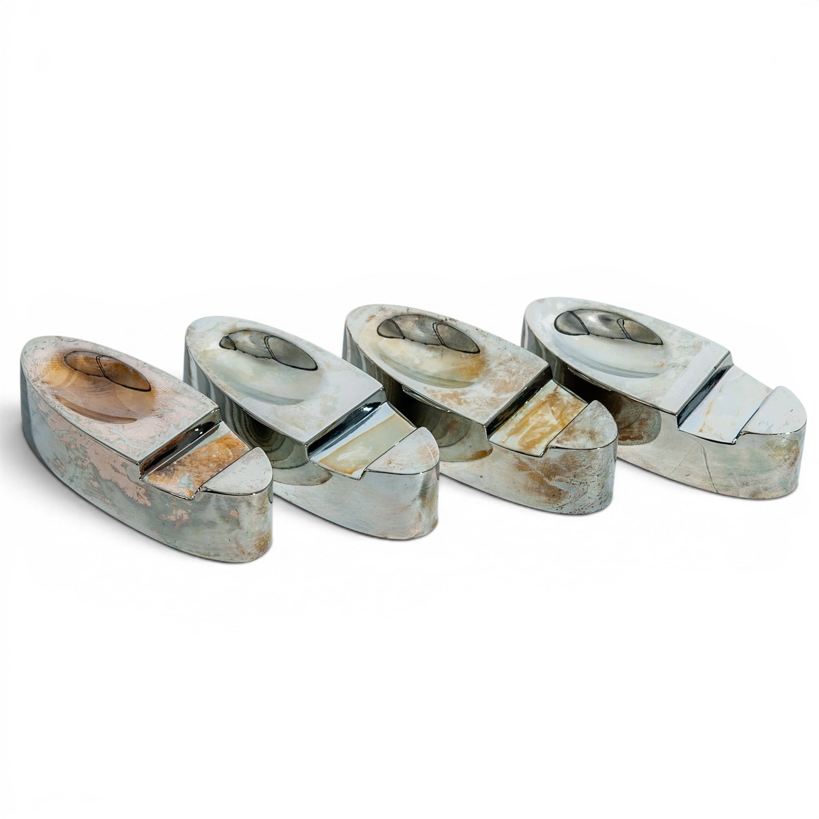 (4 pc) Miniature Oval Metal Cigar Rests: (4 pc) Miniature Oval Metal Cigar Rests Set of four miniature oval cigar rests crafted in metal, designed for holding cigars in a stable, elevated position. Each piece features a simple, compact oval