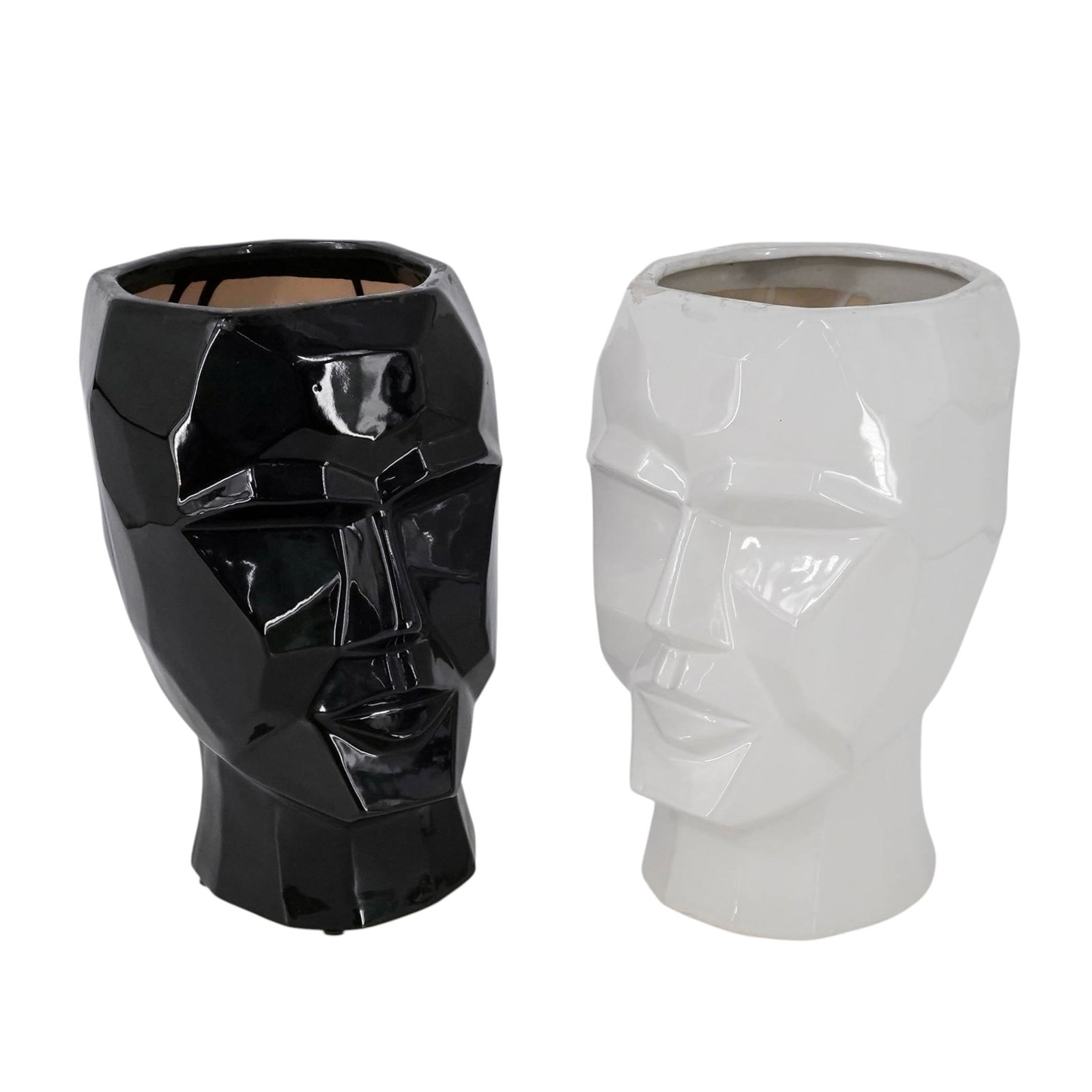 Pair of Modern Novelty Ceramic Face Vases: Pair of Modern Novelty Ceramic Face Vases 20th Cent. A pair of modern novelty ceramic face vases featuring one white and one black example. Each vase is sculpted with stylized facial features in a