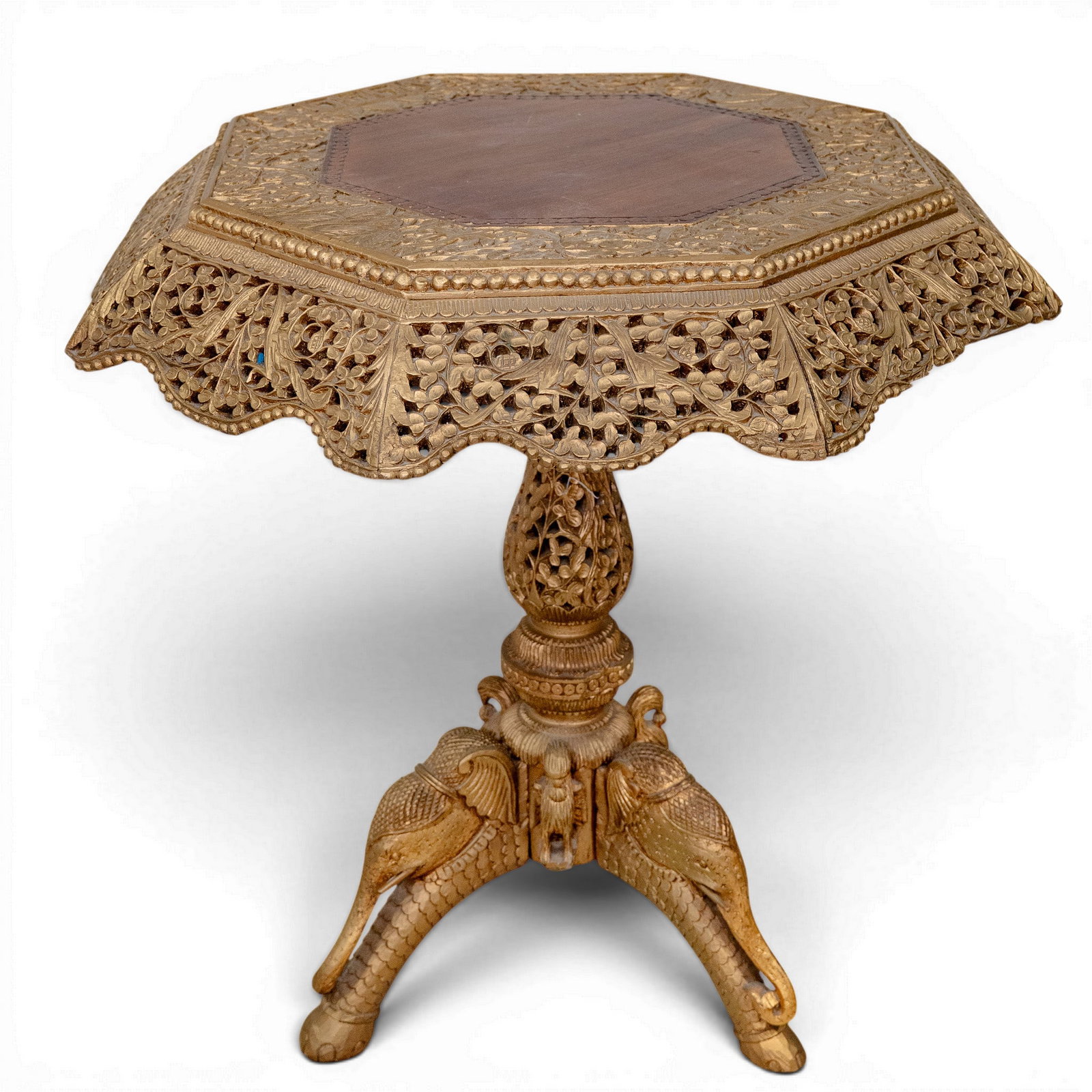 Antique Anglo-Indian Carved Wood Elephant Table: Antique Anglo-Indian Carved Wood Elephant Table Late 19th-early 20th century Antique Anglo-Indian carved wood elephant table. Features an octagonal shape framing a smooth, dark wooden center panel. Th