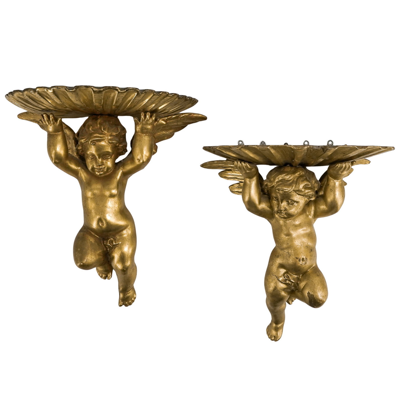Pair of Hand Carved Giltwood Cherub Shell Corbels: Pair of Hand Carved Giltwood Cherub Shell Corbels Mid-20th Century, Italy Decorative pair of giltwood wall corbels modeled as winged cherubs supporting large scallop shell platforms. Each figure is de