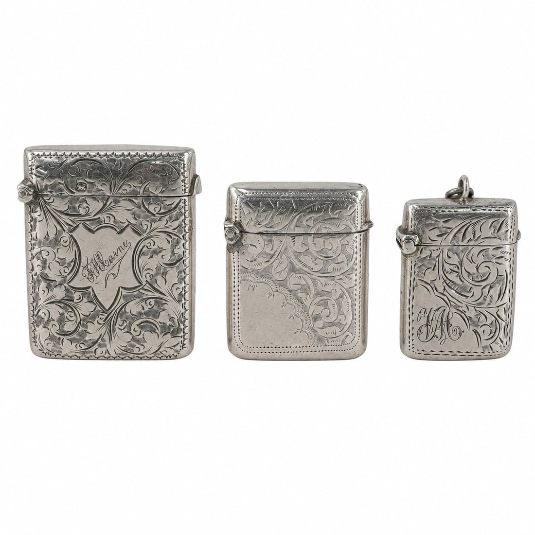 (3 pcs) William Nowill & Other English Sterling Vesta Cases: (3 pcs) William Nowill & Other English Sterling Vesta Cases Late 19th-early 20th century, English A set of three antique English sterling silver vesta cases. (1) William Nowill (Sheffield, reg. 1825) 