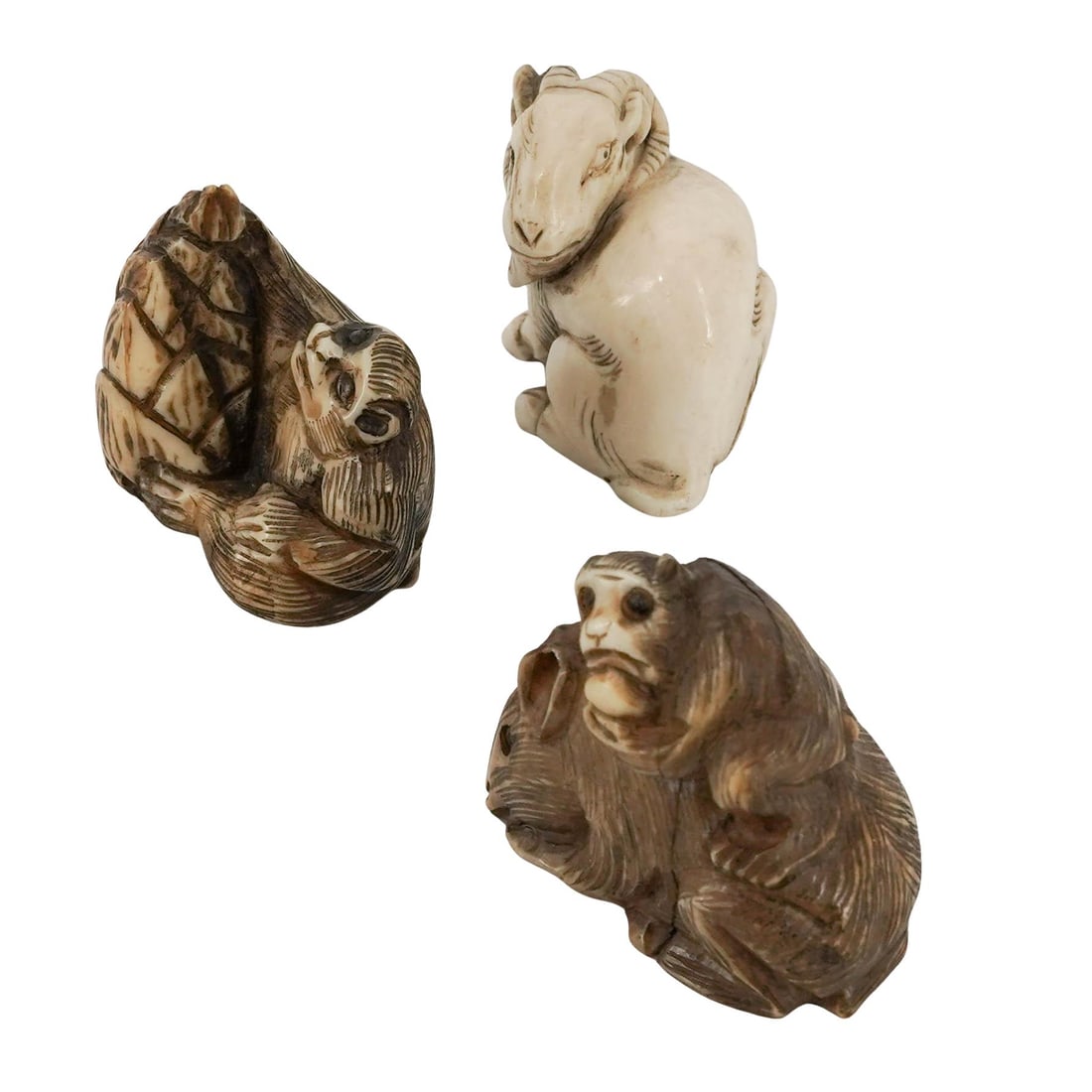 (3 pc) Japanese Carved Bone Animal Netsukes: (3 pc) Japanese Carved Bone Animal Netsukes 20th Century, Japan Grouping of three Japanese carved bone netsuke animal figures, including a seated monkey beside a large tree, a ram with finely carved c
