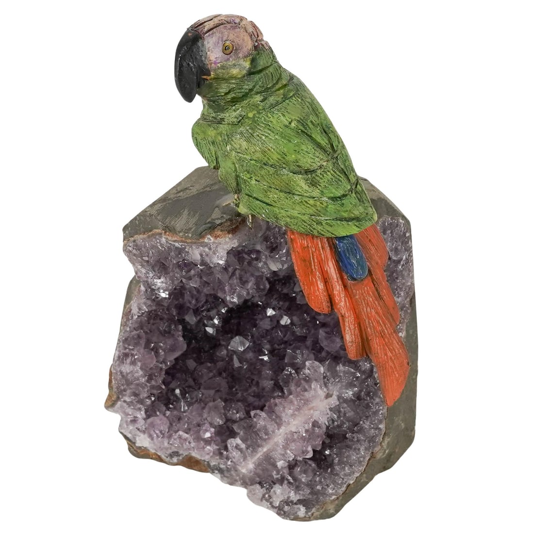 Carved Semi Precious Stone Parrot On Amethyst Crystal: Carved Semi Precious Stone Parrot On Amethyst Crystal Late 20th Century, Continental Decorative carved hardstone sculpture depicting a colorful parrot with green plumage, black beak, and orange and bl