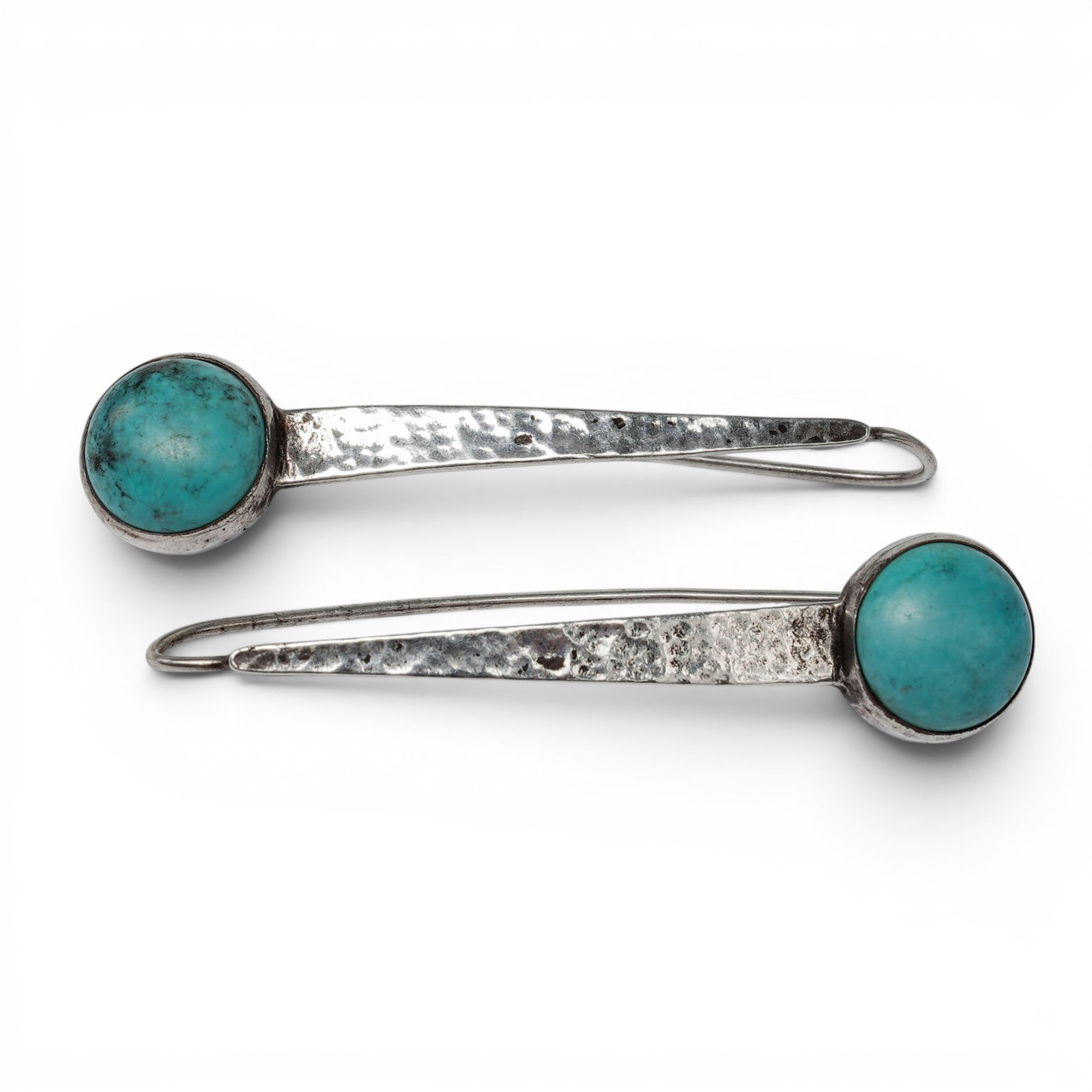 A pair of Chinese sterling silver and turquoise drop earrings: A pair of Chinese sterling silver and turquoise drop earrings 21st century, China Stamped: 925 / China / [maker's mark] Long tapered drop earrings set with oval turquoise cabochons in smooth bezels, s
