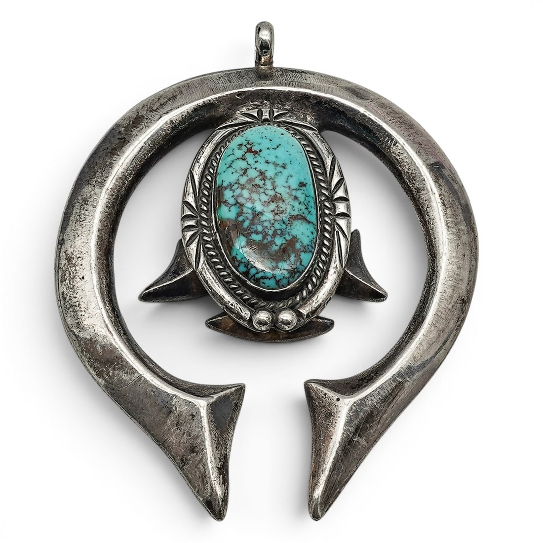 A Navajo sterling silver and turquoise naja pendant (1 of 3)