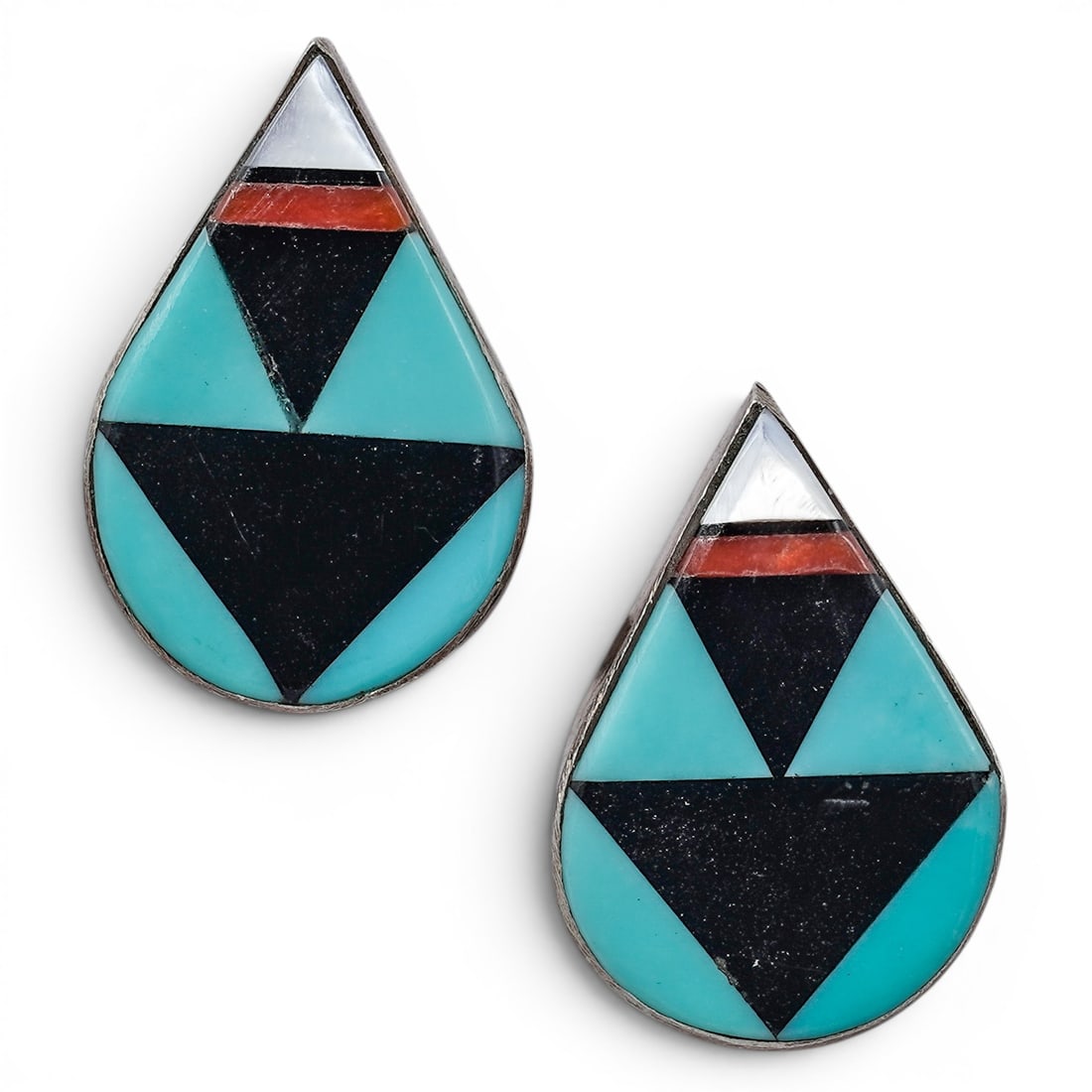 A pair of Zuni Pueblo sterling silver and multi-stone inlay teardrop earrings: A pair of Zuni Pueblo sterling silver and multi-stone inlay teardrop earrings Late 20th century Unmarked. Tests for sterling. A pair of stud earrings, each with a teardrop-form top executed in geometr