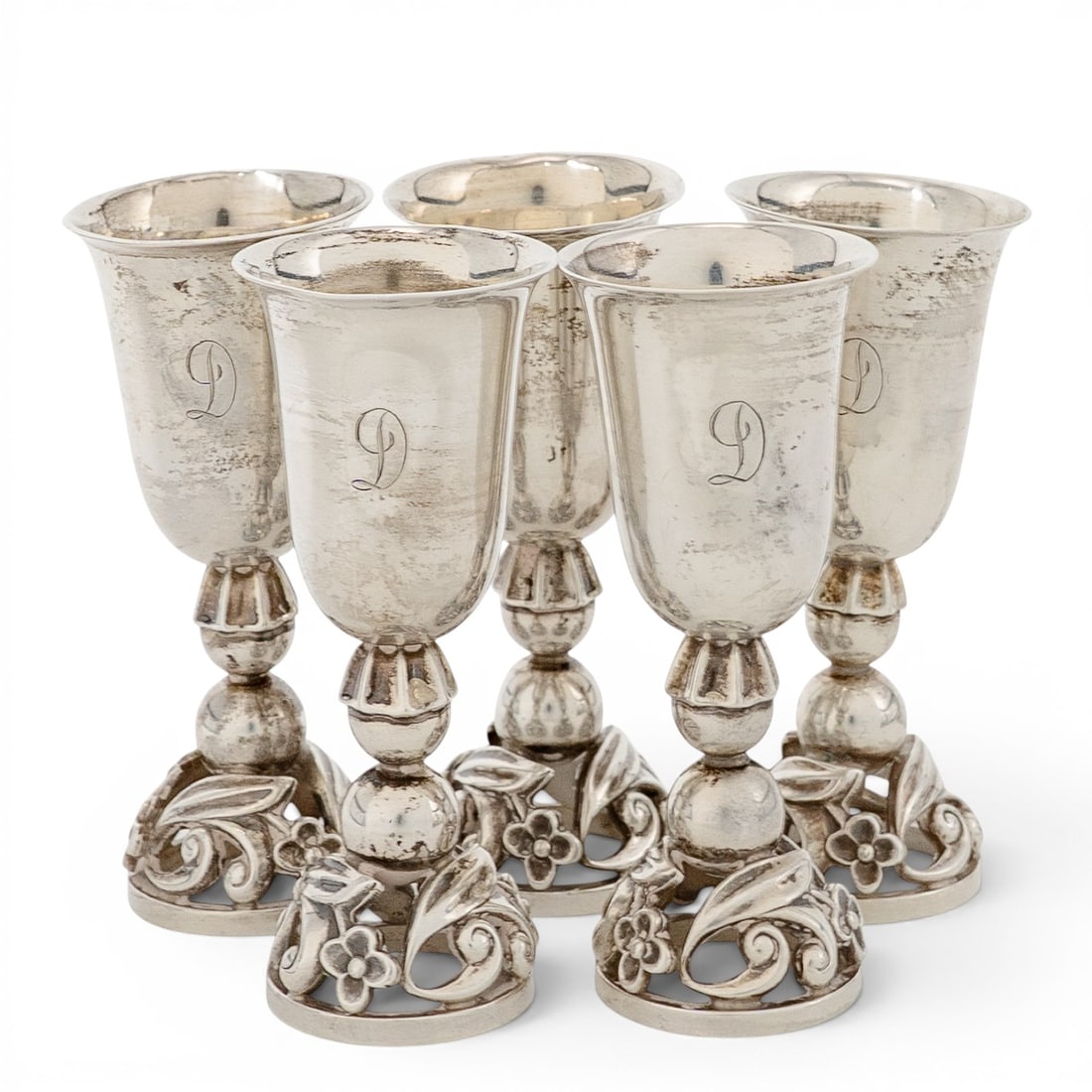 (5 pc) Georg Jensen Sterling Silver Cordials: (5 pc) Georg Jensen Sterling Silver Cordials Early - Mid 20th Cent, Denmark Set of five sterling silver cordial cups by Georg Jensen, each featuring a floral motif base with molded detailing and polis