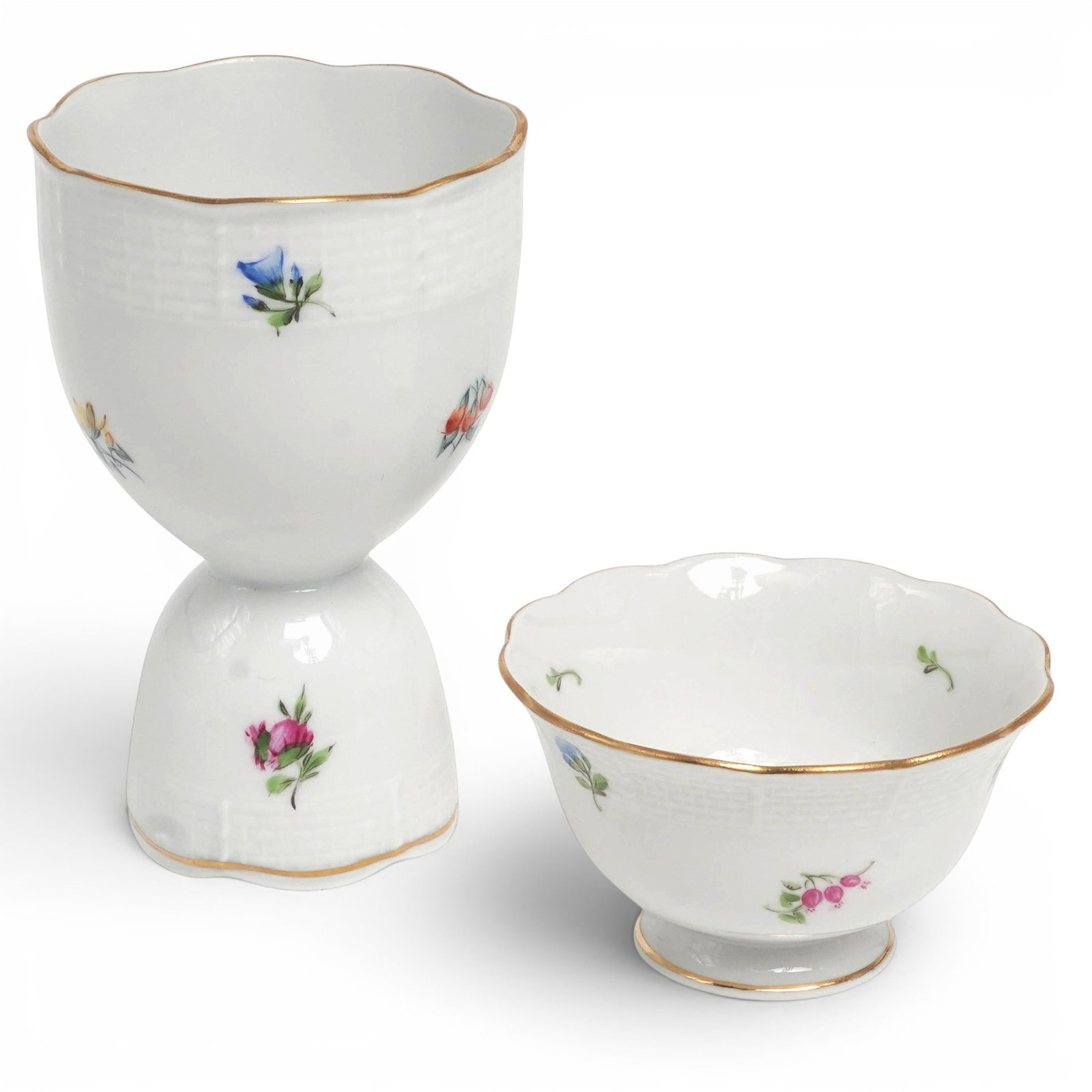 (2 pc) Herend Mille Fleur Porcelain Egg Cups: (2 pc) Herend Mille Fleur Porcelain Egg Cups Mid 20th Cent, Hungary Pair of porcelain egg cups by Herend Porcelain Manufactory in the Mille Fleur pattern. One taller and one shorter form, each hand-pa