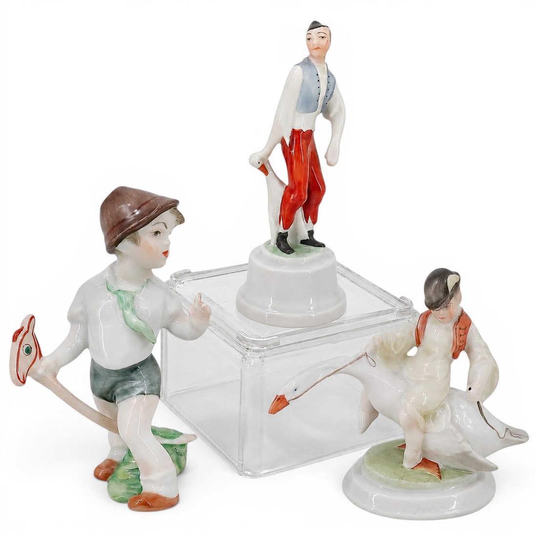 (3 pcs) Herend Porcelain Figurines: (3 pcs) Herend Porcelain Figurines 20th century, Hungarian A set of three Herend porcelain figurines. Each are hallmarked for Herend on bottom. (1) Boy with goose figurine. Measurements: H 4" x Base W