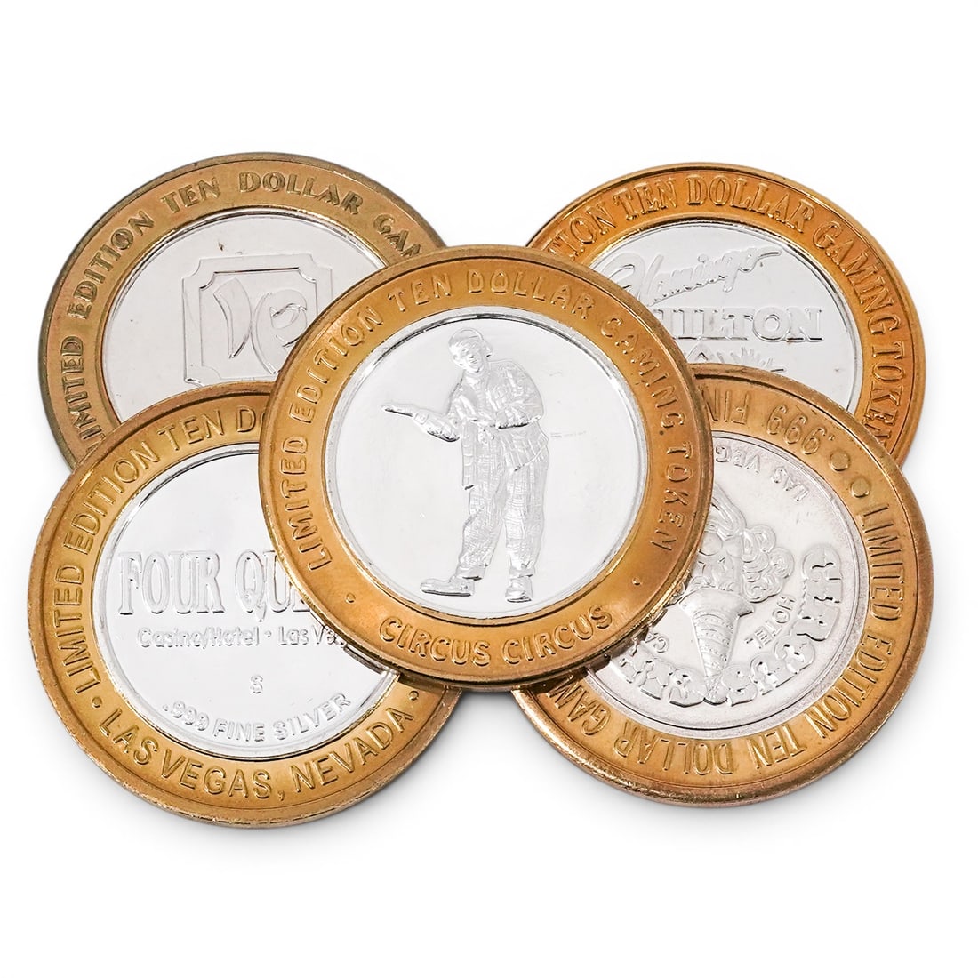 (5 pc) .999 Silver Vegas Gaming Coins: (5 pc) .999 Silver Vegas Gaming Coins 20th Century, USA Group of five limited-edition Las Vegas casino gaming tokens, each featuring a .999 fine silver center surrounded by a brass-tone ring. Marked "