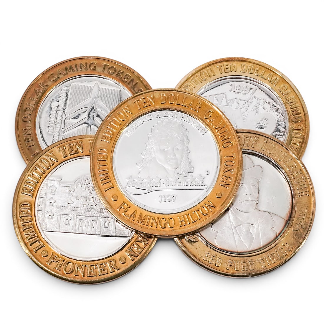 (5 pc) .999 Silver Vegas Gaming Coins: (5 pc) .999 Silver Vegas Gaming Coins 20th Century, USA Group of five limited-edition Las Vegas and Nevada casino gaming tokens, each featuring a .999 fine silver center encased within a brass-tone ou
