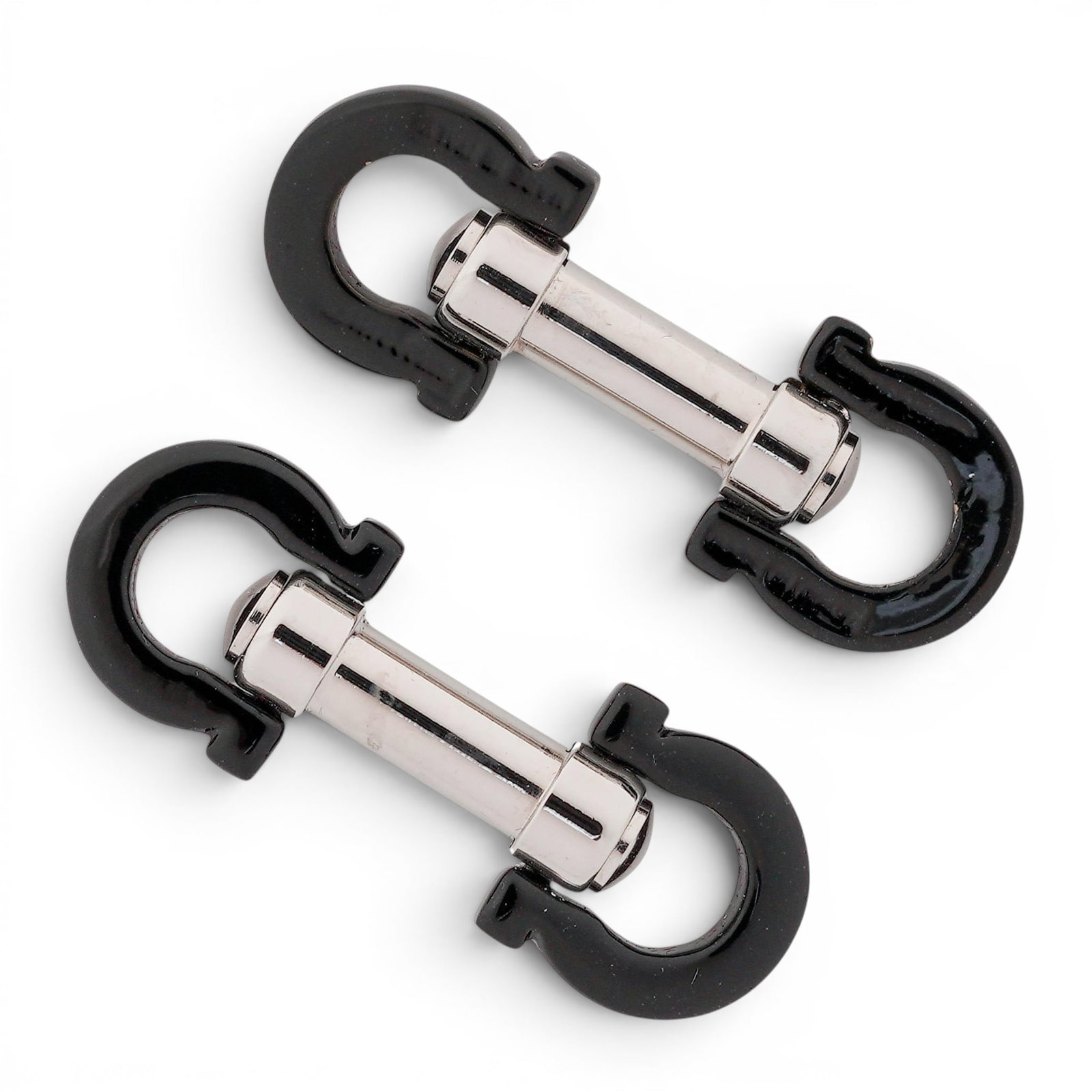 Vintage Salvatore Ferragamo Double Gancini Cufflinks: Vintage Salvatore Ferragamo Double Gancini Cufflinks Late 20th Century, Italy Pair of Salvatore Ferragamo cufflinks featuring the iconic Double Gancini motif. Each cufflink is designed with polished s