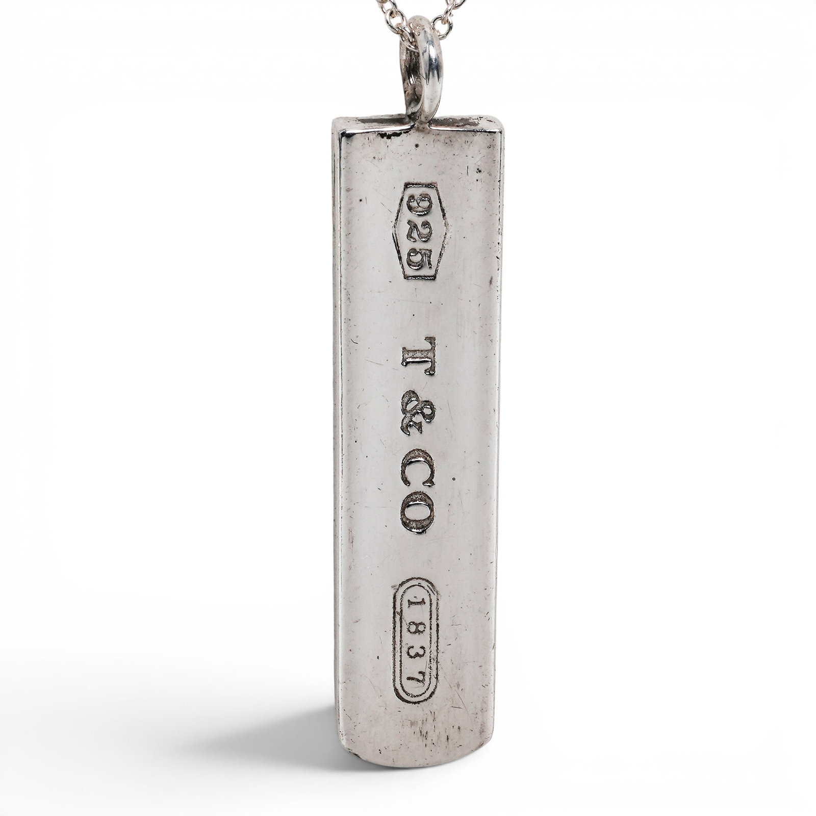 Tiffany & Co. Sterling Silver 1837 Bar Pendant Necklace: Tiffany & Co. Sterling Silver 1837 Bar Pendant Necklace 2000s, USA Sterling silver rectangular bar pendant with Tiffany & Co.'s iconic 1837 collection styling, suspended from a fine cable link chain w