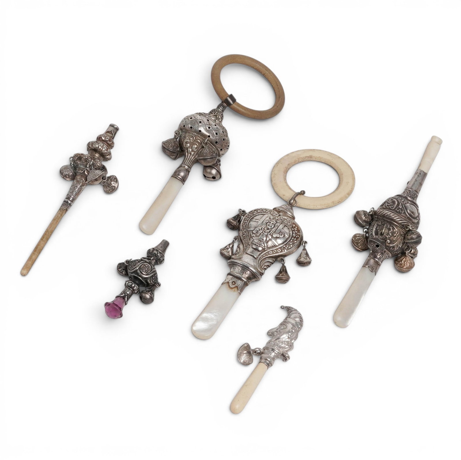 (6 pcs) Antique English Sterling Silver Baby Rattles: (6 pcs) Antique English Sterling Silver Baby Rattles Late 19th-early 20th century, English Six English sterling silver baby rattles. (1) Mother of pearl handled sterling baby rattle with carved bone r